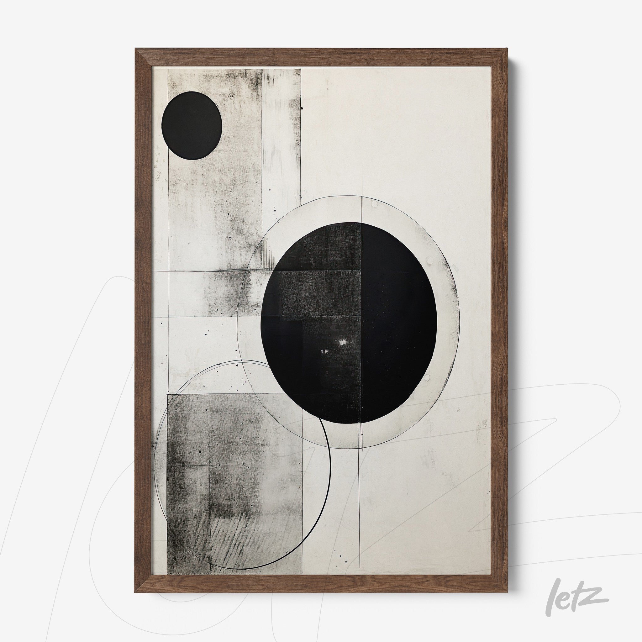 framed abstract wall art in black and white featuring circles and geometric shapes with light wood frame