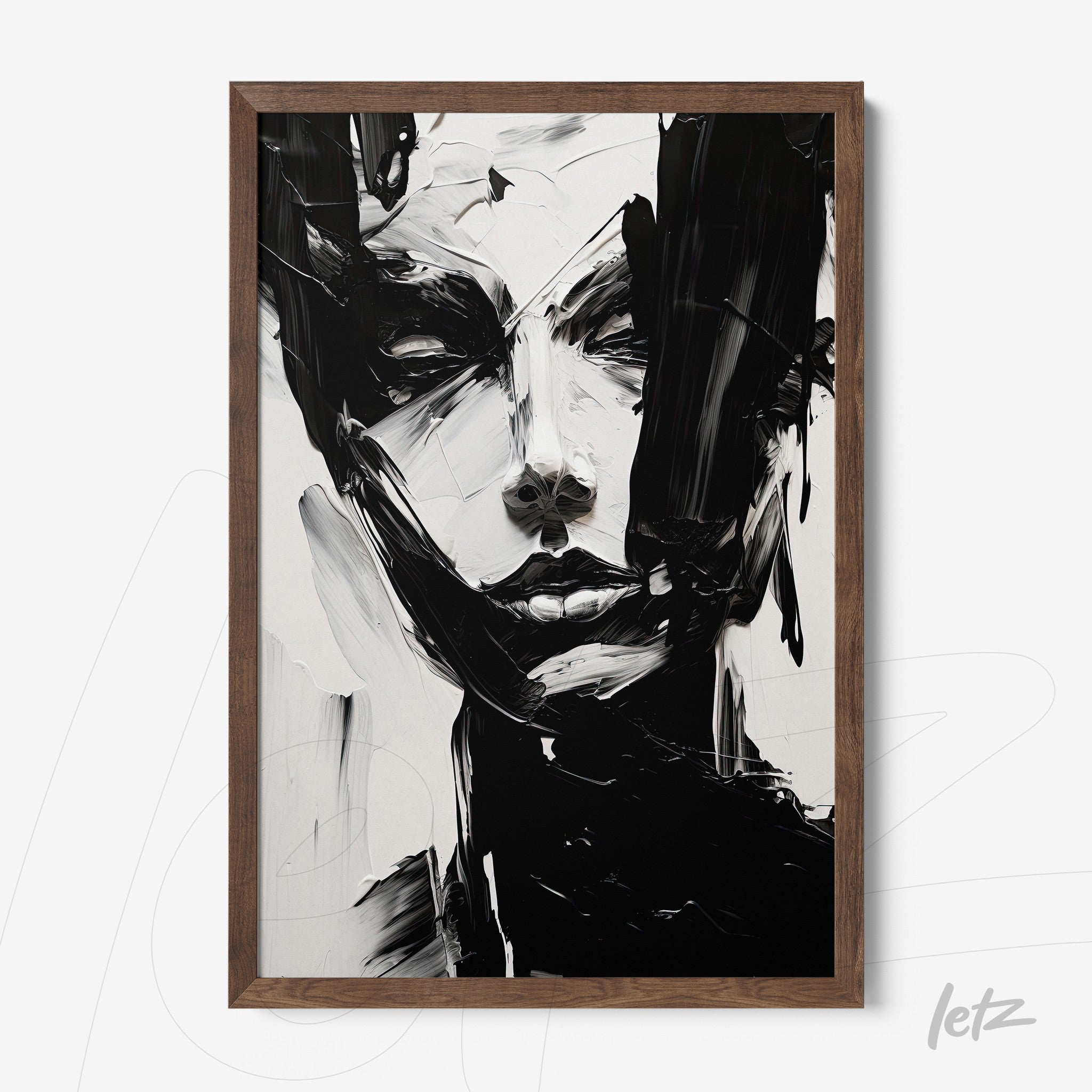 framed abstract art piece in black and white featuring a woman's face with dark wooden frame