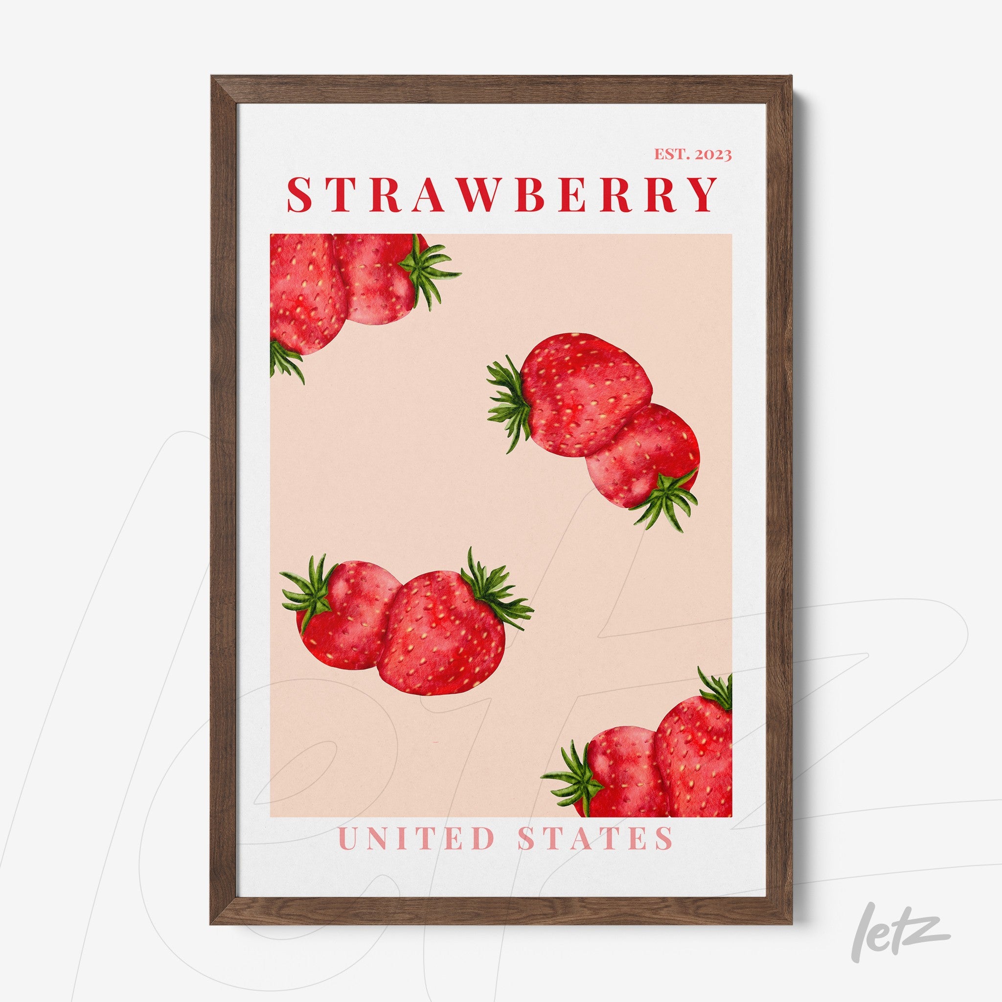 framed wall art featuring strawberries on pink background with dark wood frame and text 'STRAWBERRY' and 'UNITED STATES'