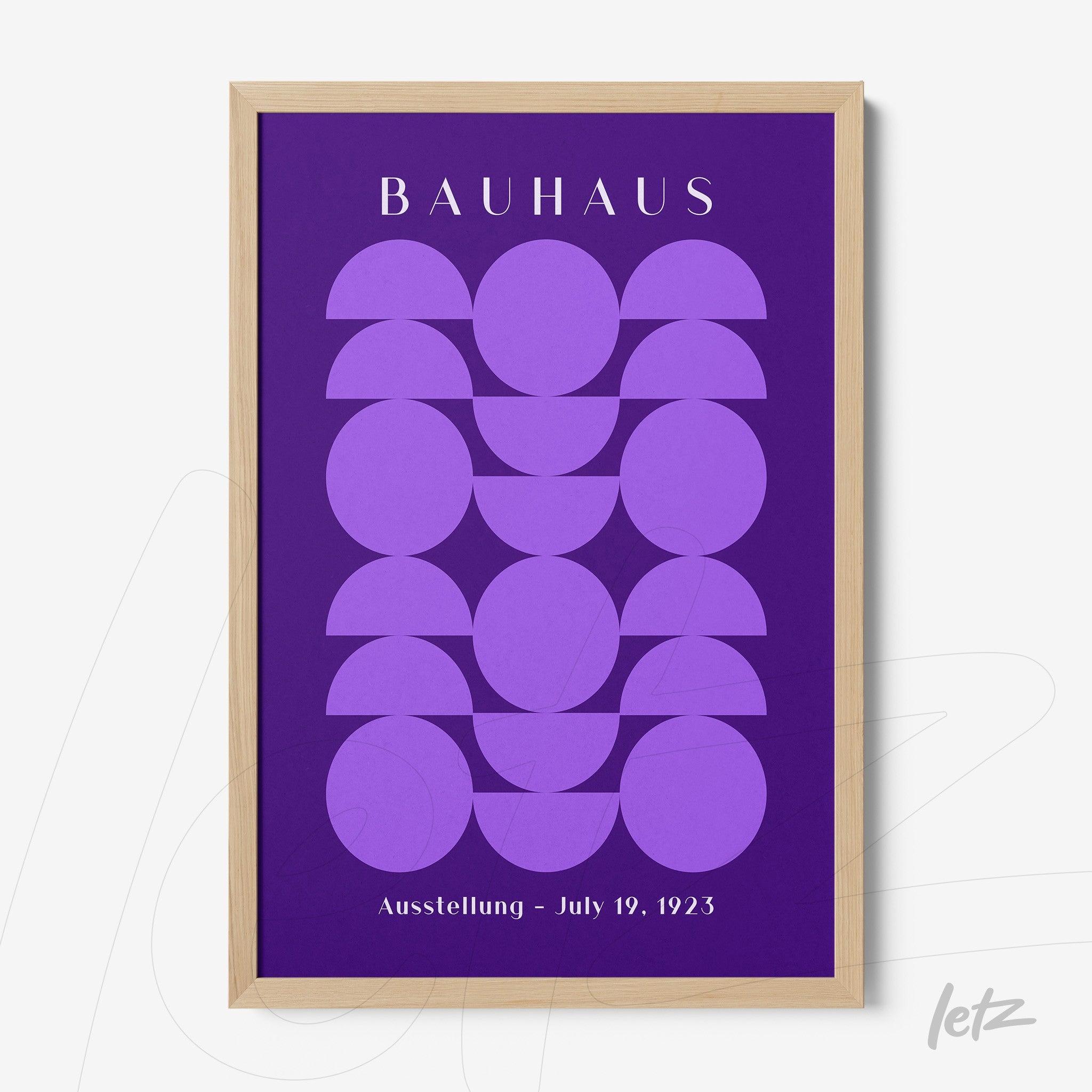 poster print featuring purple circles on a violet background with light wood frame