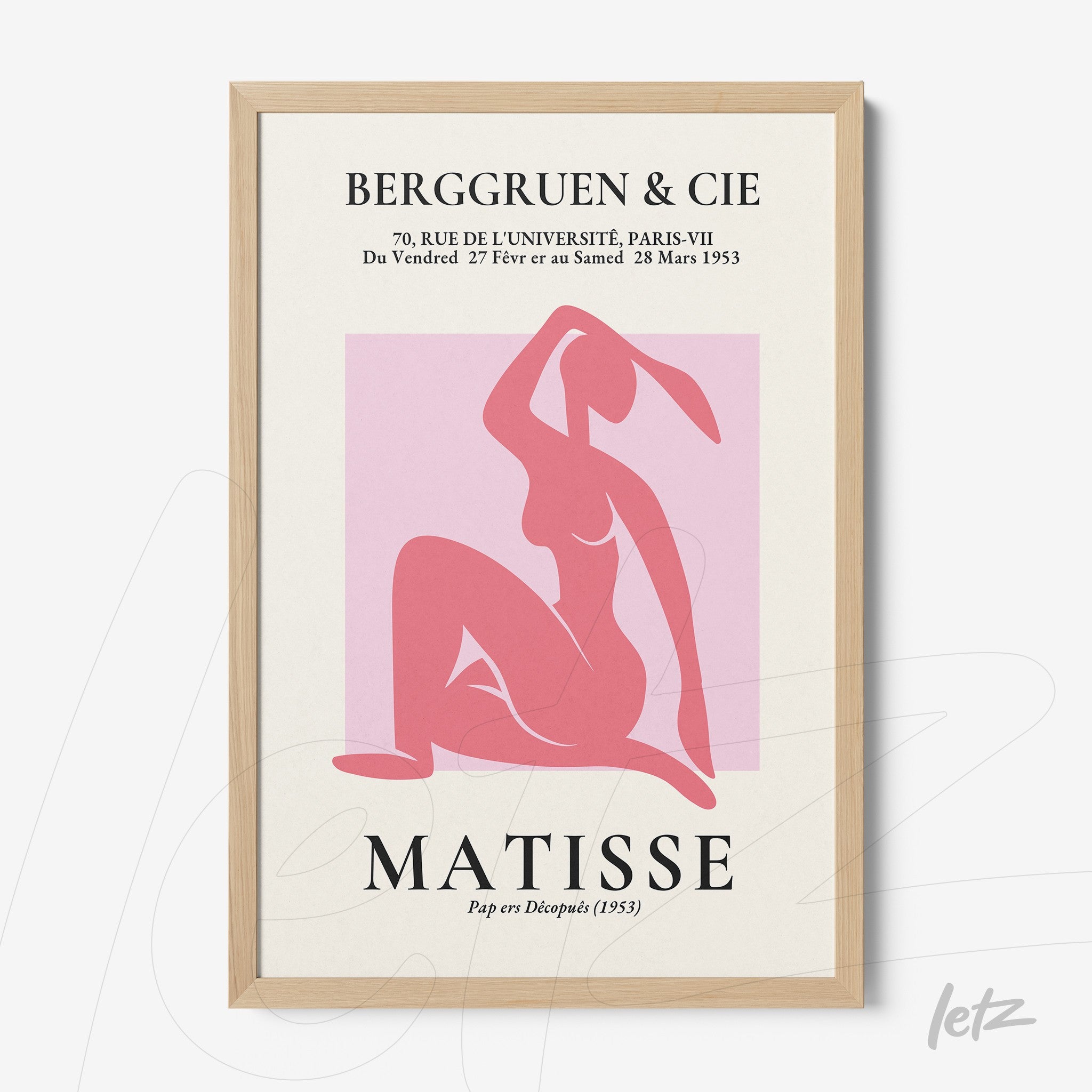 framed modern art print in pink featuring a seated female figure with light wooden frame