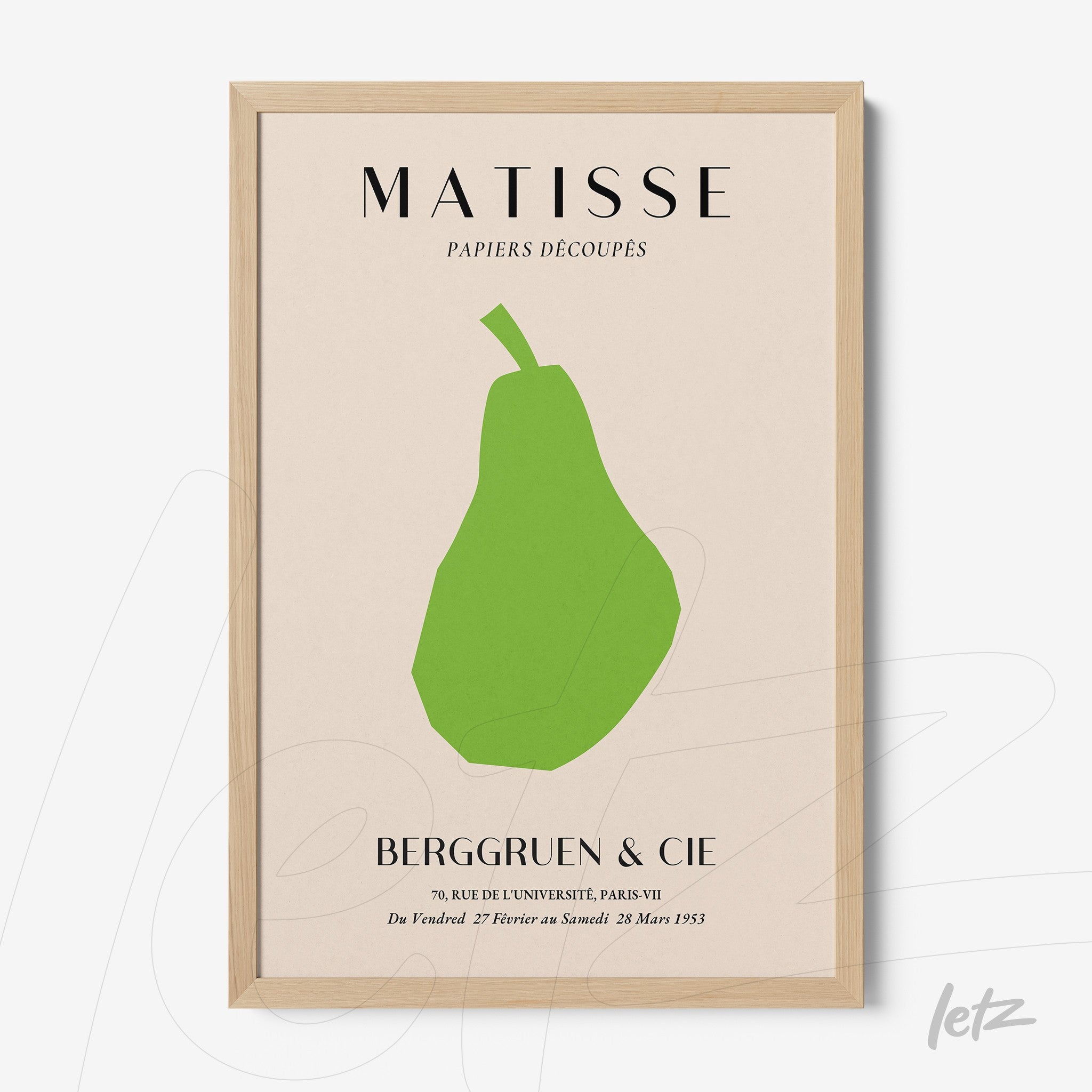 framed art print featuring a stylized paper cut of a pear on light background with light wood frame