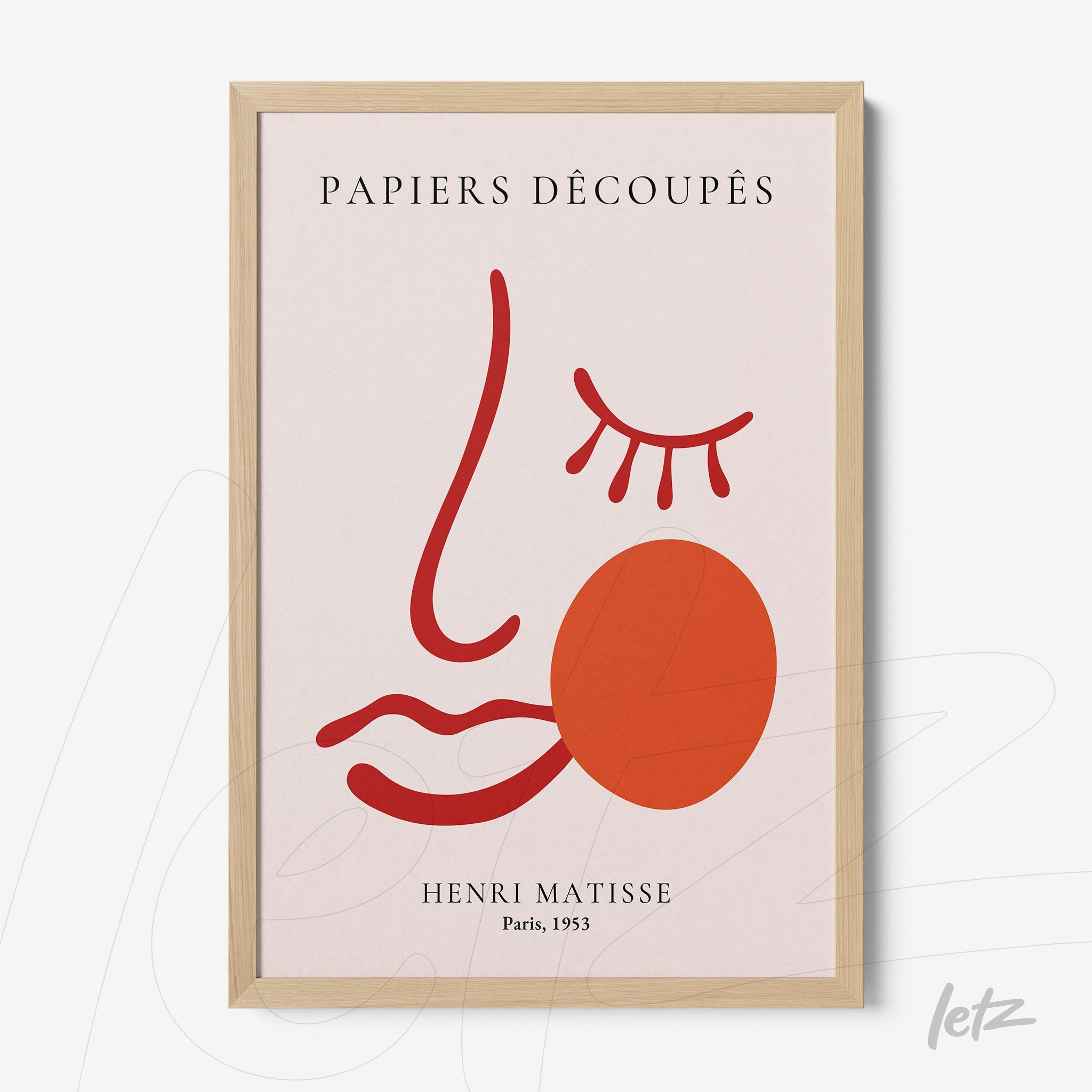 framed wall art featuring an abstract stylized face design in light background, with red lines and a round orange shape