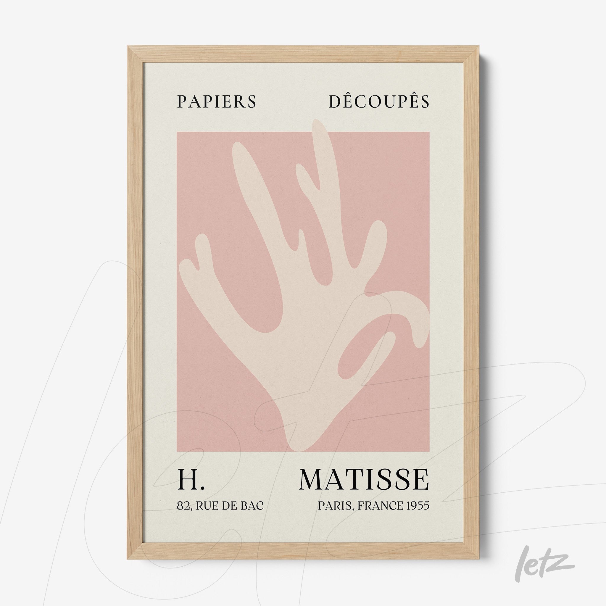 framed modern art featuring a stylized hand on a pink background