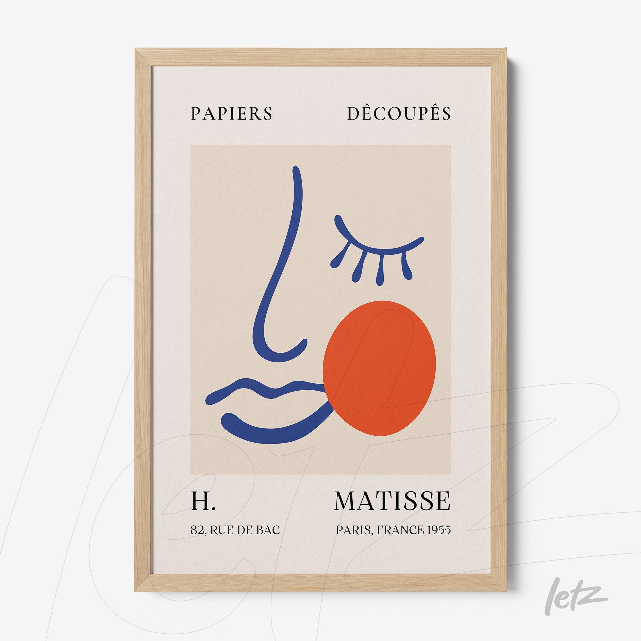 contemporary framed art featuring an abstract face in vibrant colors with light wood frame