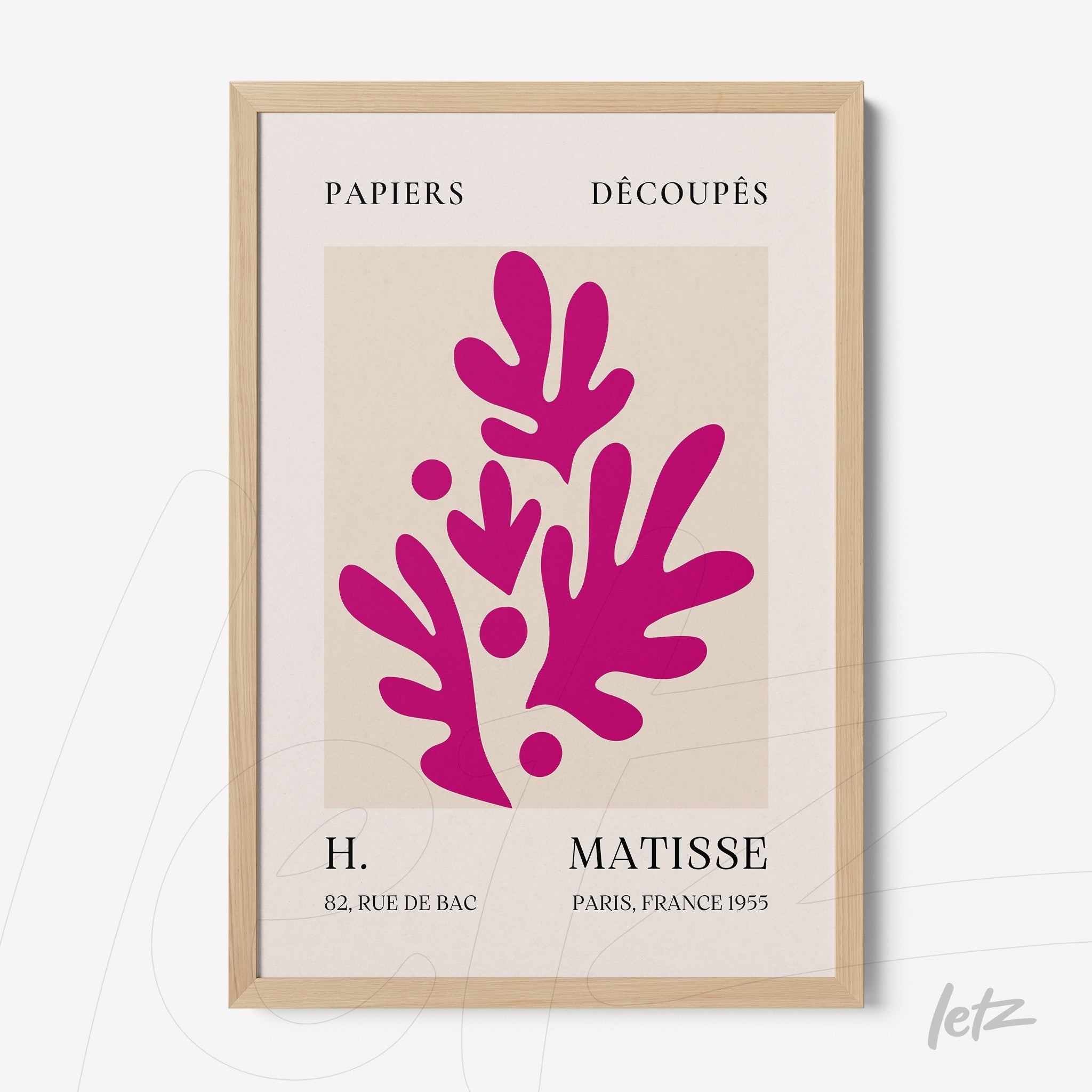 decorative wall art featuring modern design in shades of pink depicting leaves, light wooden frame