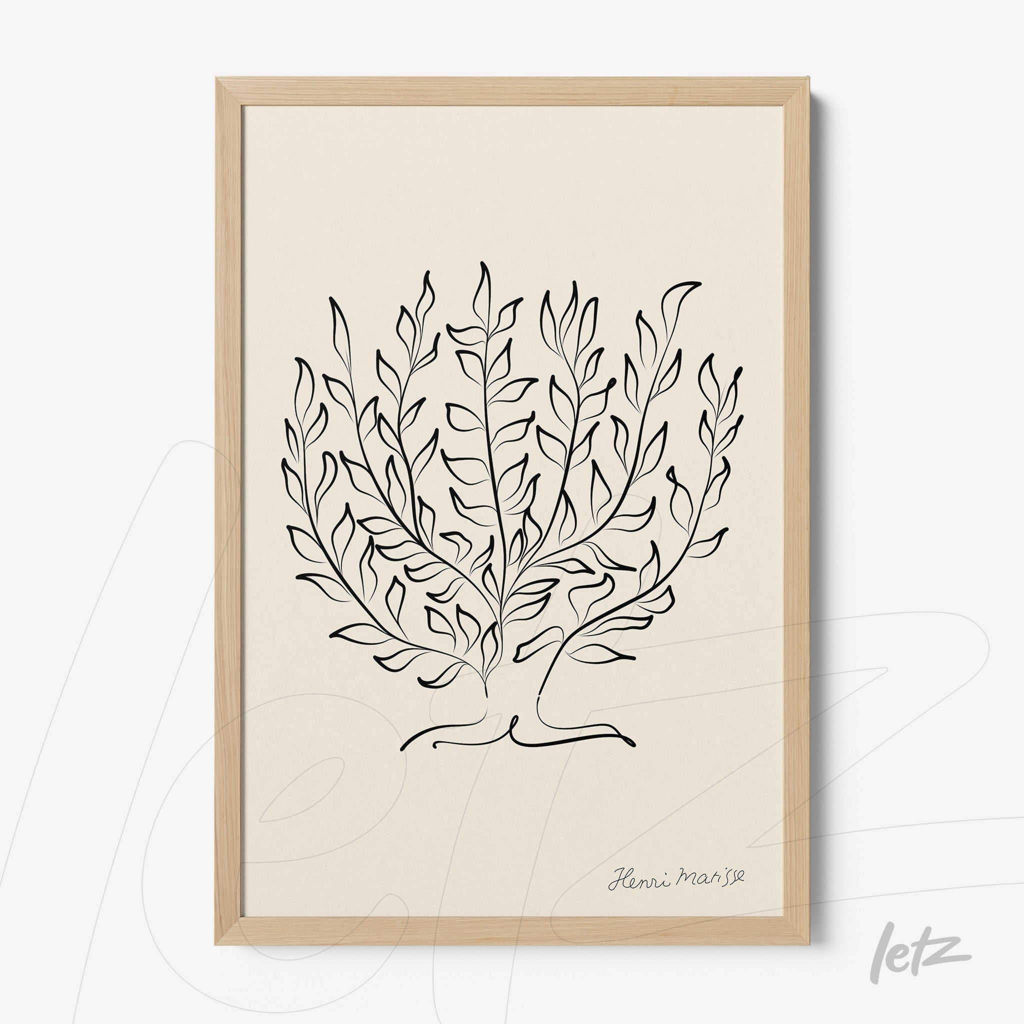 framed artwork featuring minimalist black line drawings of foliage with light wood frame