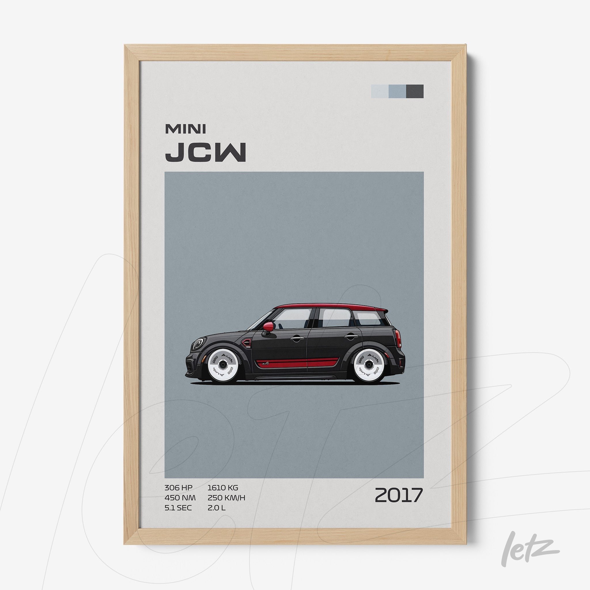 framed wall art featuring a digital illustration of a 2017 Mini John Cooper Works with light wood frame and gray background