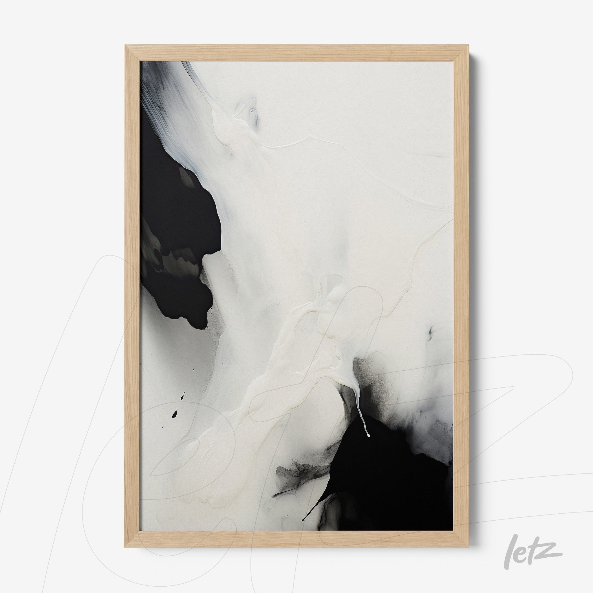framed abstract artwork in black and white with light wood frame