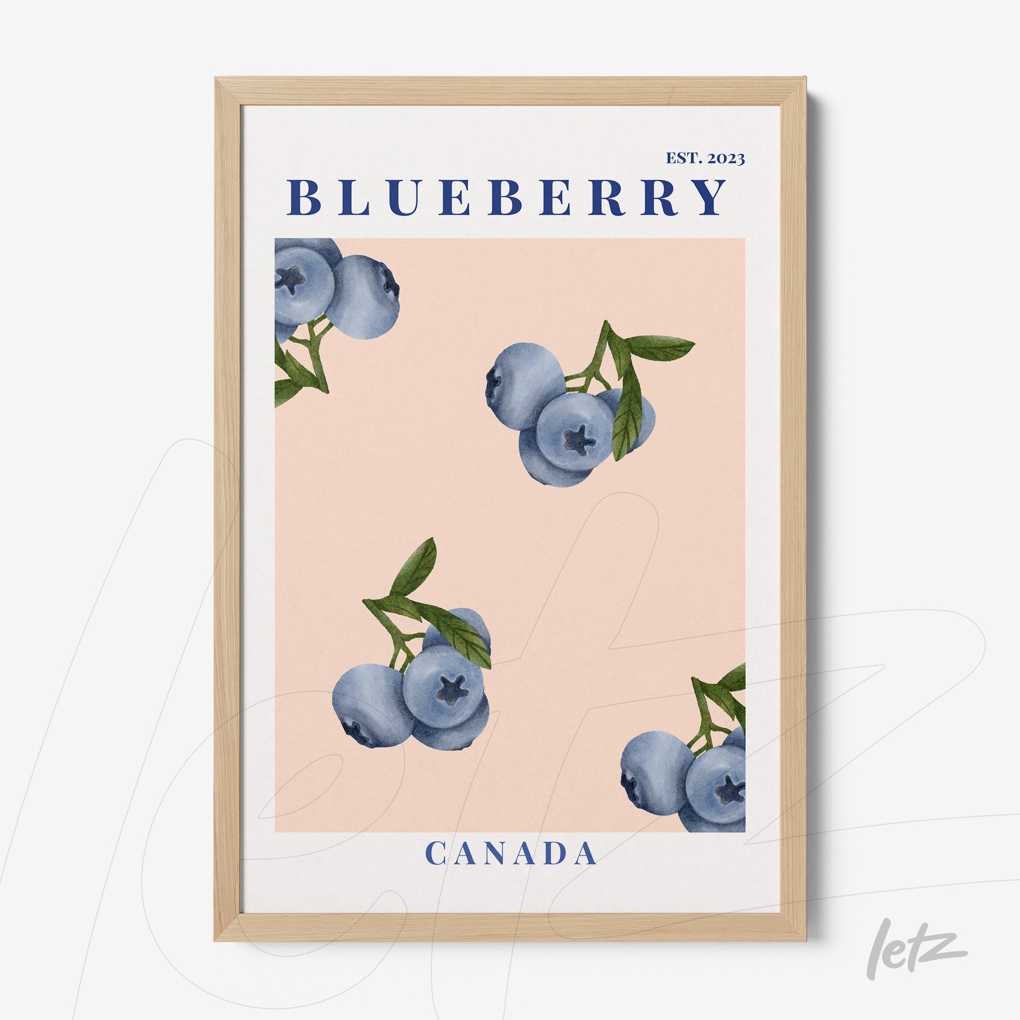 framed artwork featuring blueberries on a pink background with light wooden frame