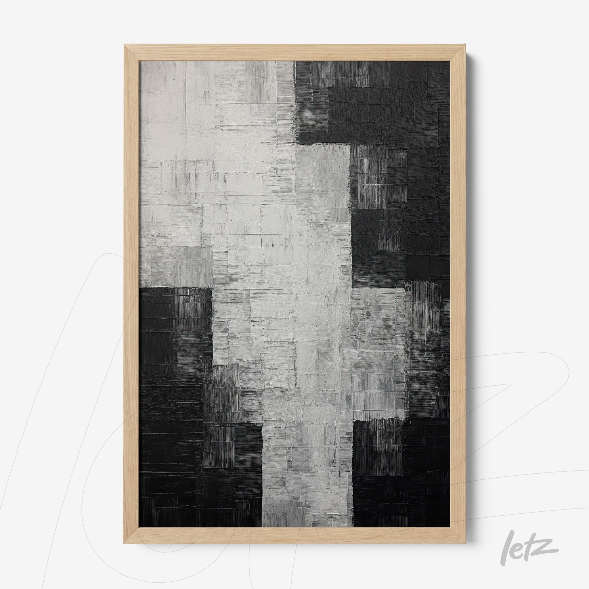 abstract black and white artwork with textured relief in light wood frame