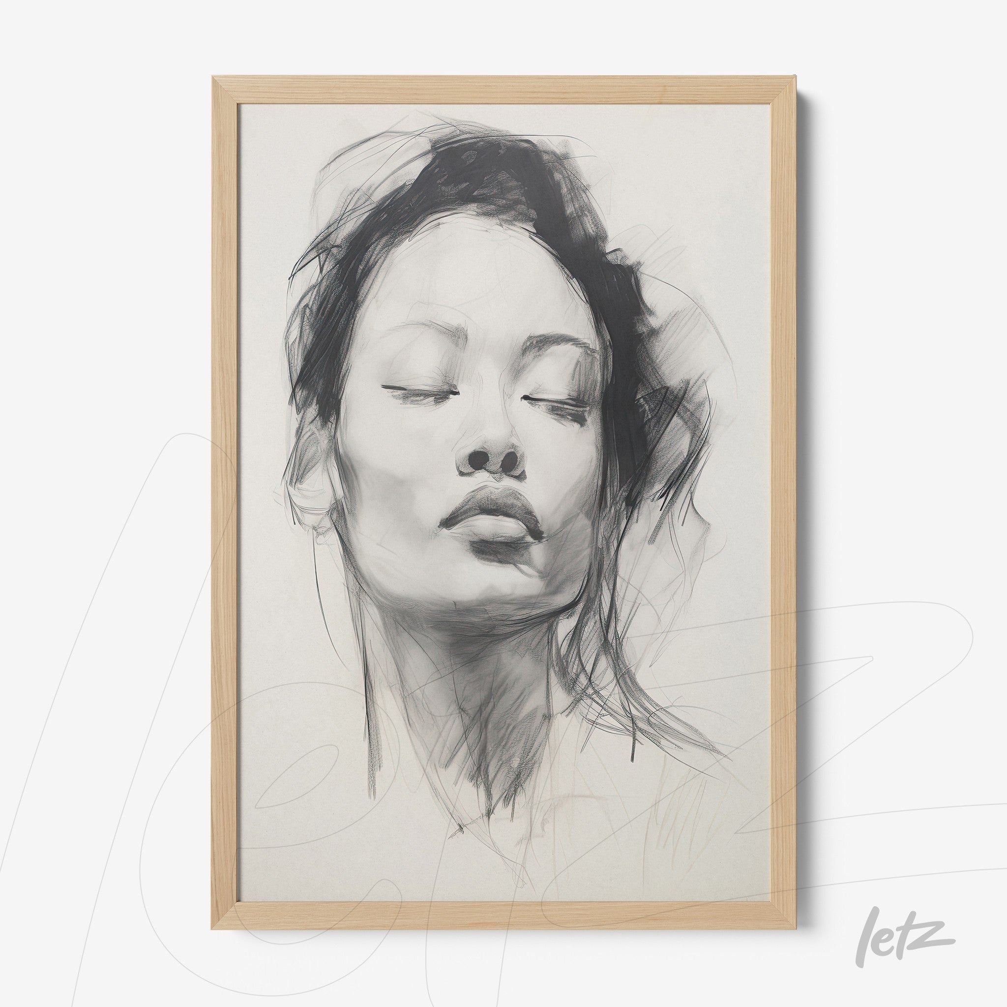 framed black and white portrait of a serene woman in light wooden frame