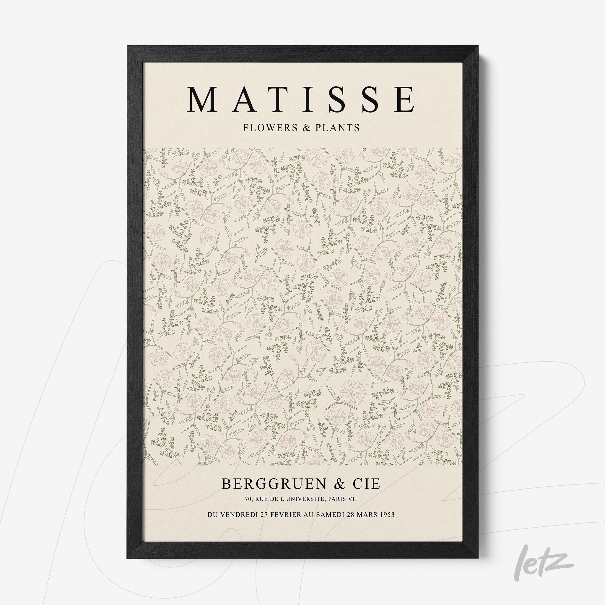 framed vintage style wall art featuring a light background with floral and leaf patterns in black frame