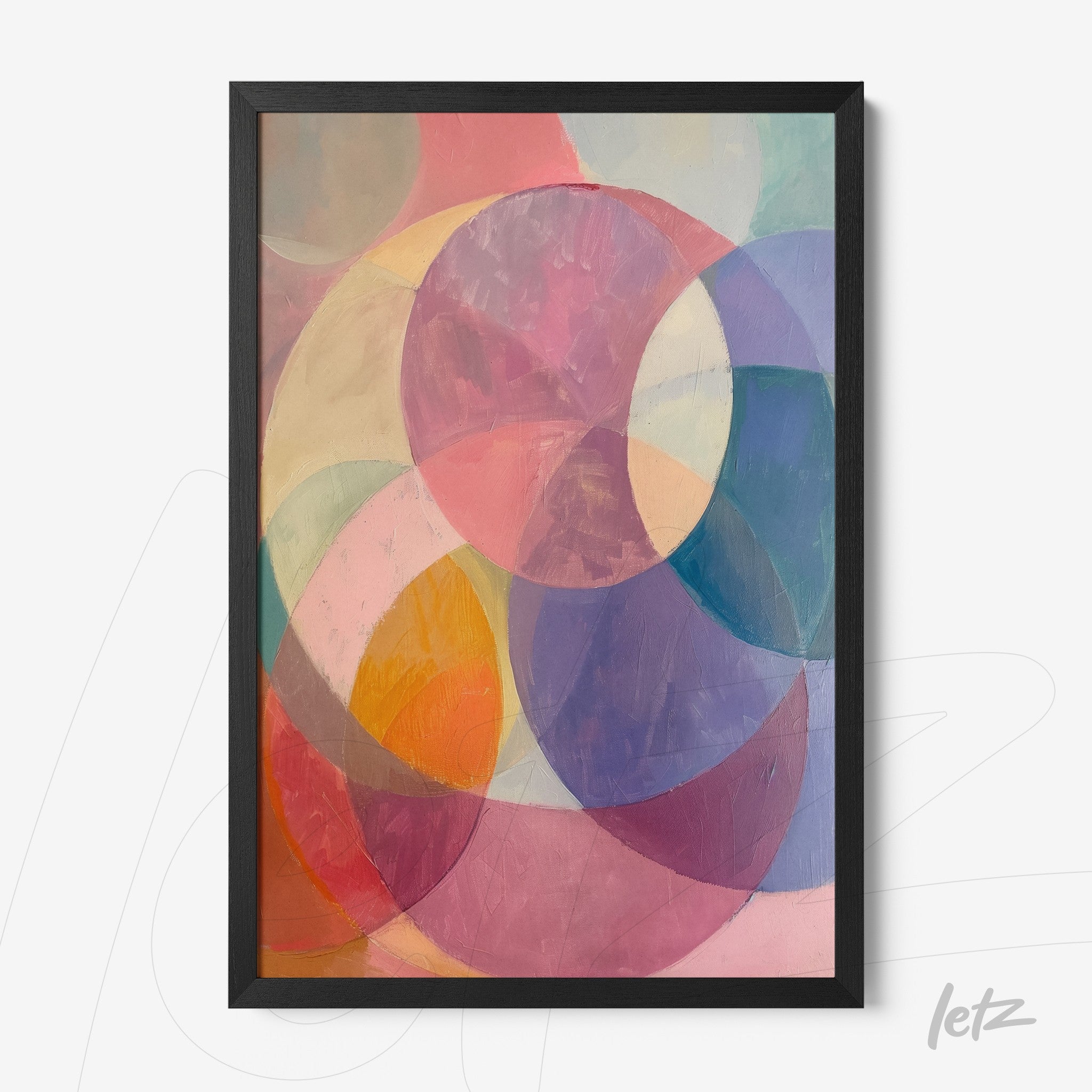 framed abstract art featuring circular shapes in pastel tones