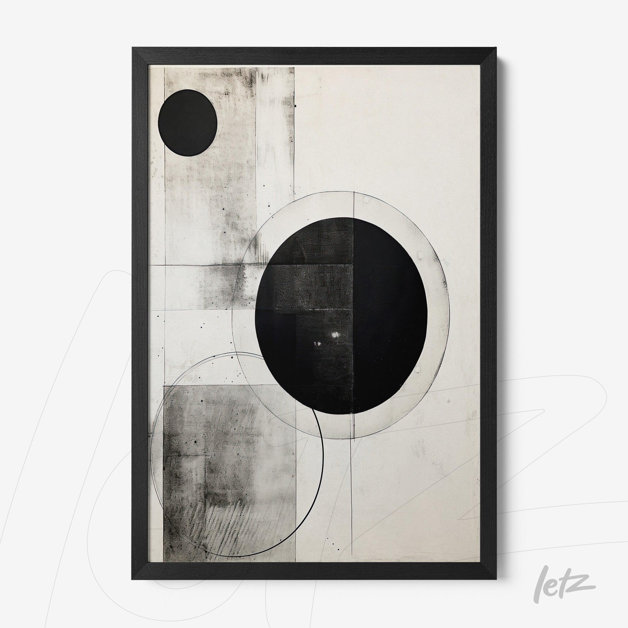 abstract wall art in black and white featuring circular geometric shapes on a light background with a black frame