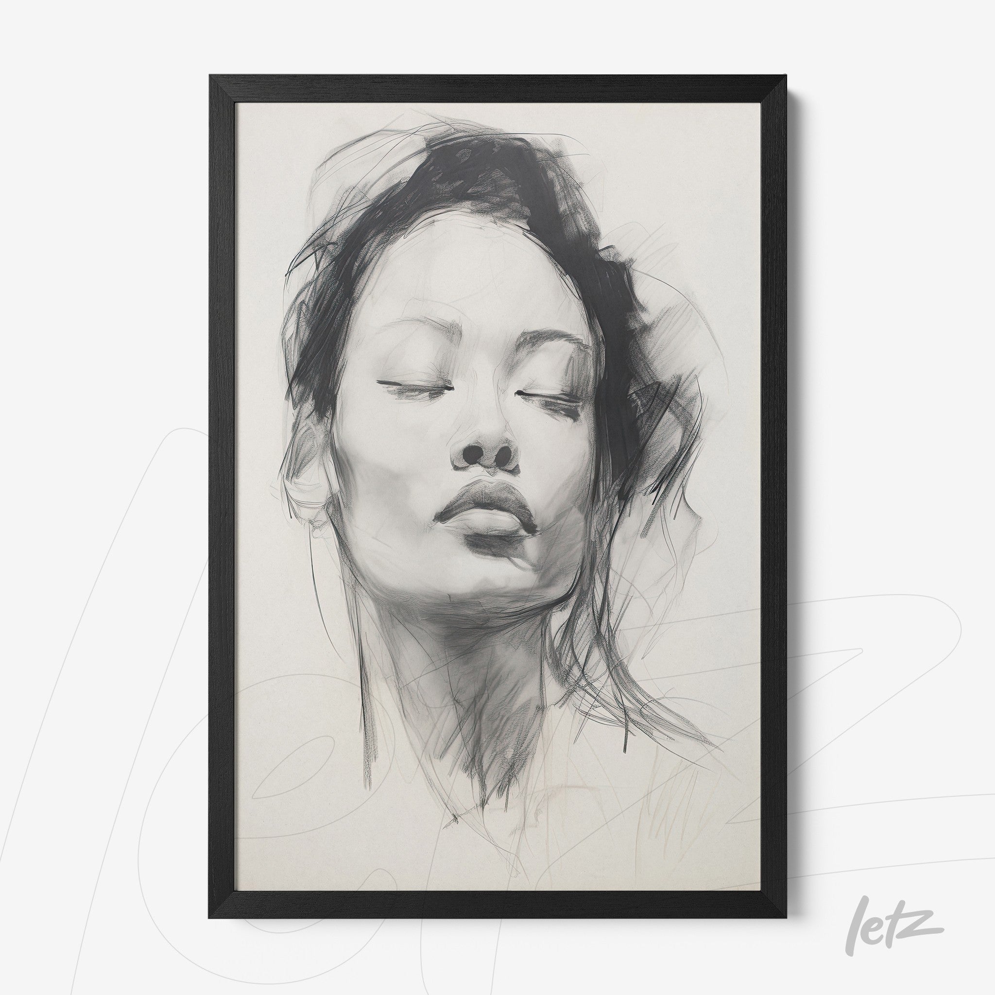 framed artwork of a woman with closed eyes in black frame