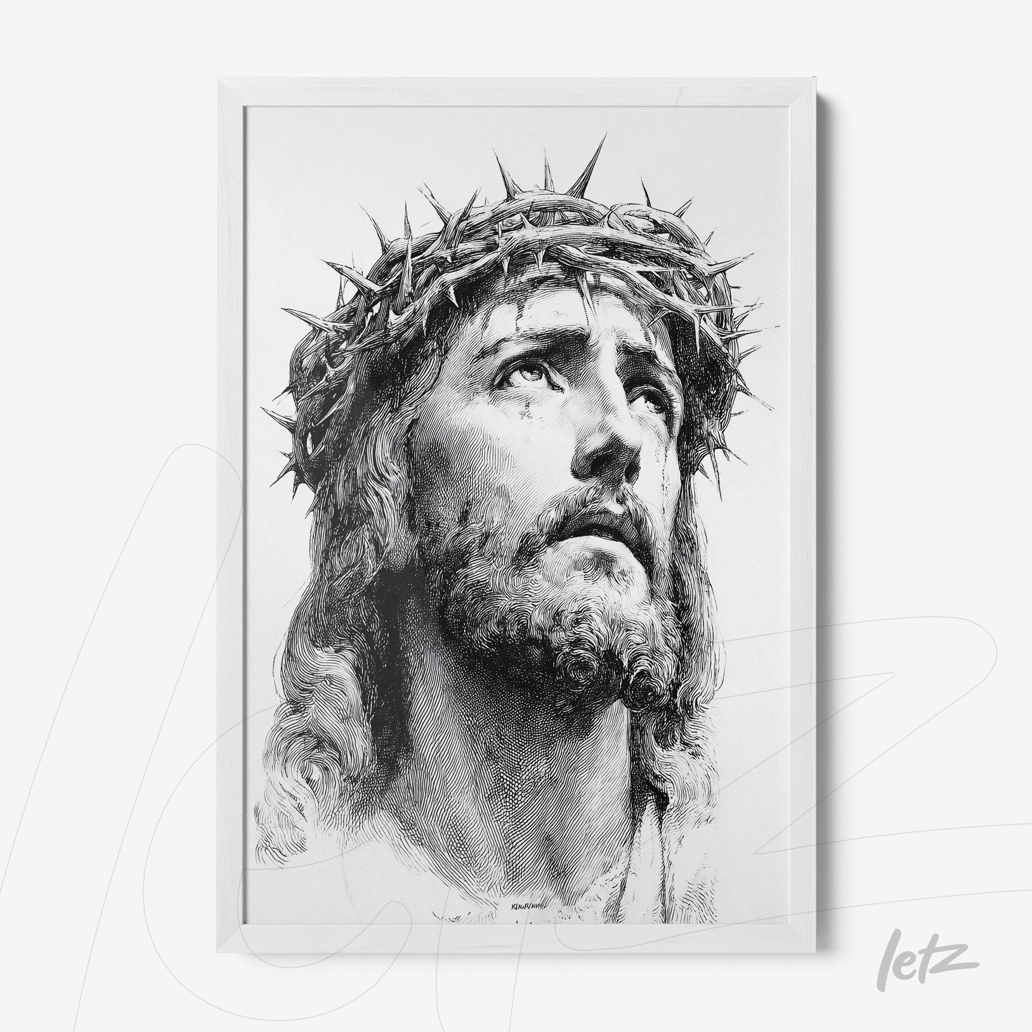 framed artwork depicting a detailed portrait of Jesus Christ wearing a crown of thorns with a white frame