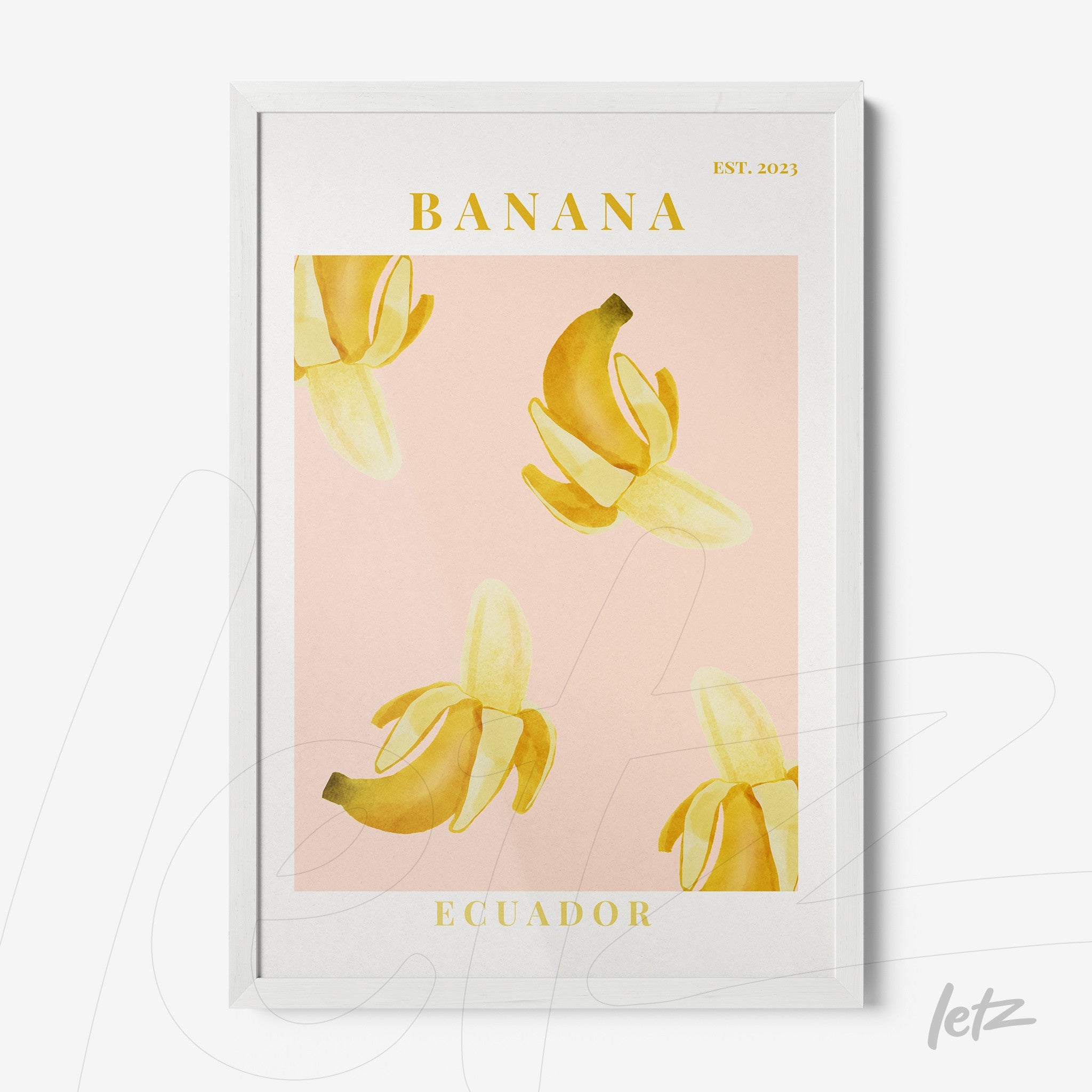 framed artwork featuring yellow bananas on a pink background with white frame