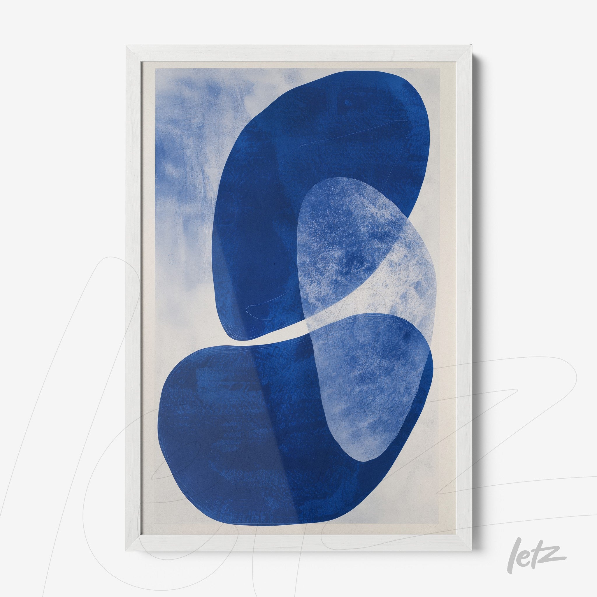 framed wall art featuring abstract shapes in blue tones with white frame