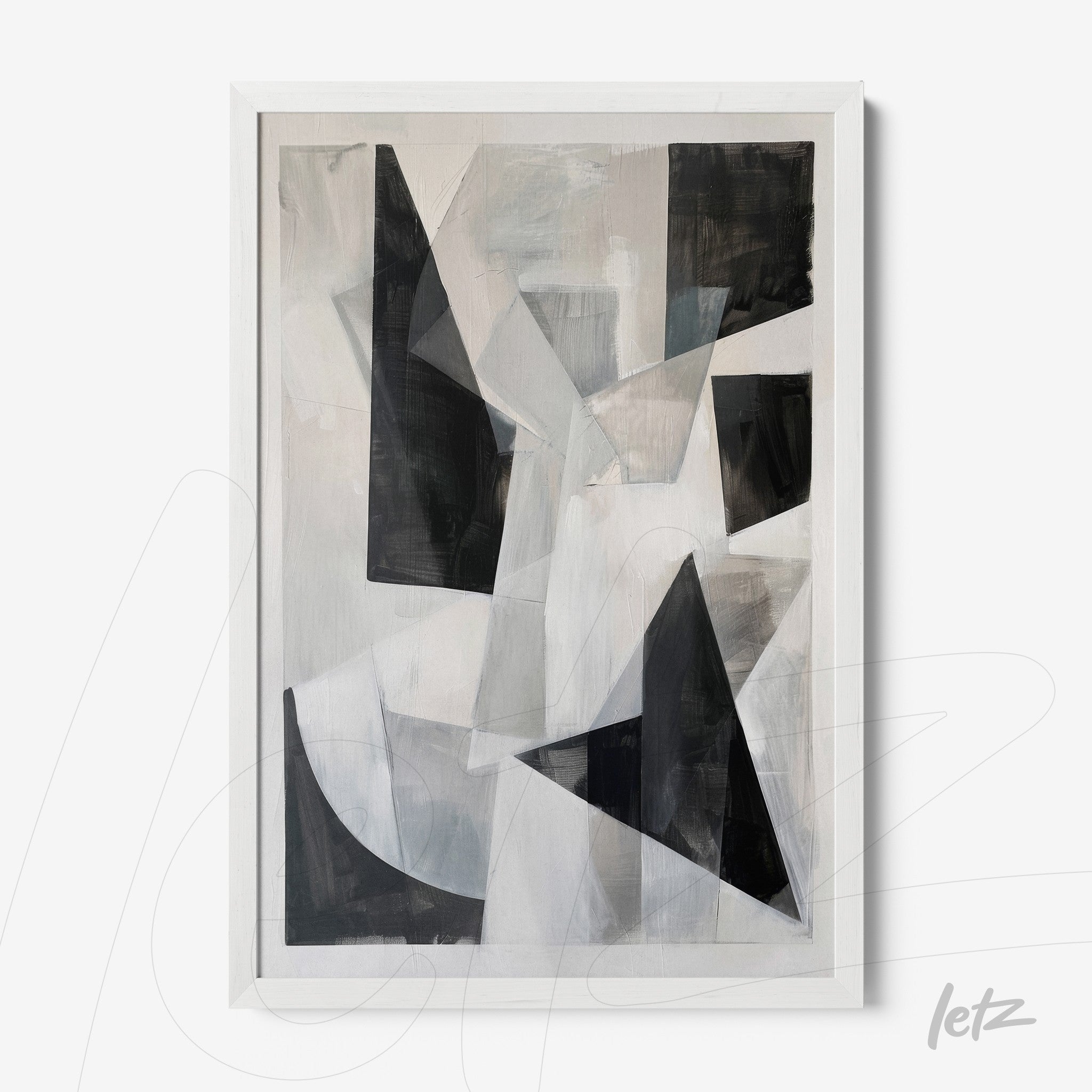 abstract wall art in shades of black, white, and gray in a white frame