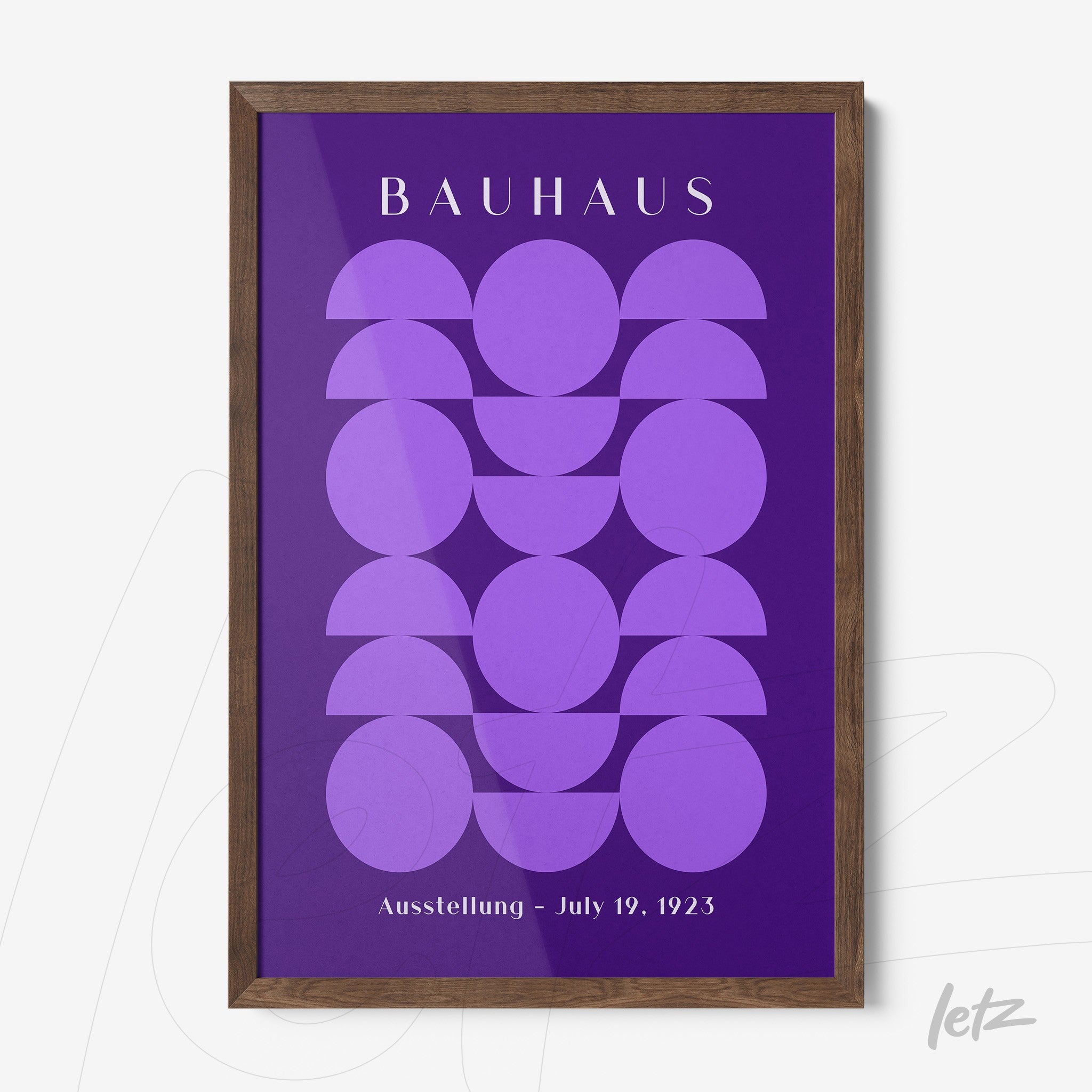 poster featuring purple geometric art and bauhaus text in wooden frame