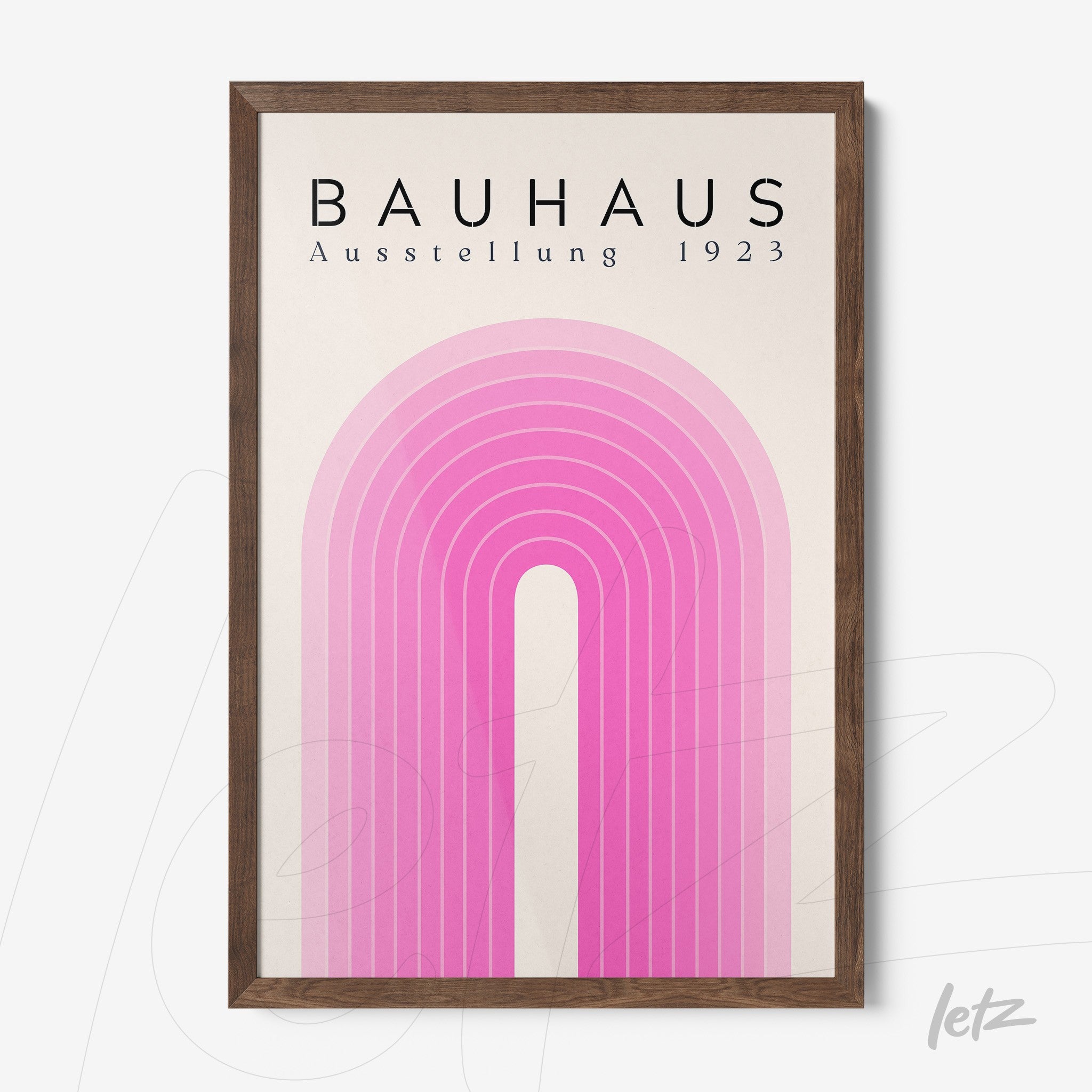 wood framed poster featuring geometric design in shades of pink portraying a stylized rainbow, top text reads 'bauhaus ausstellung 1923'