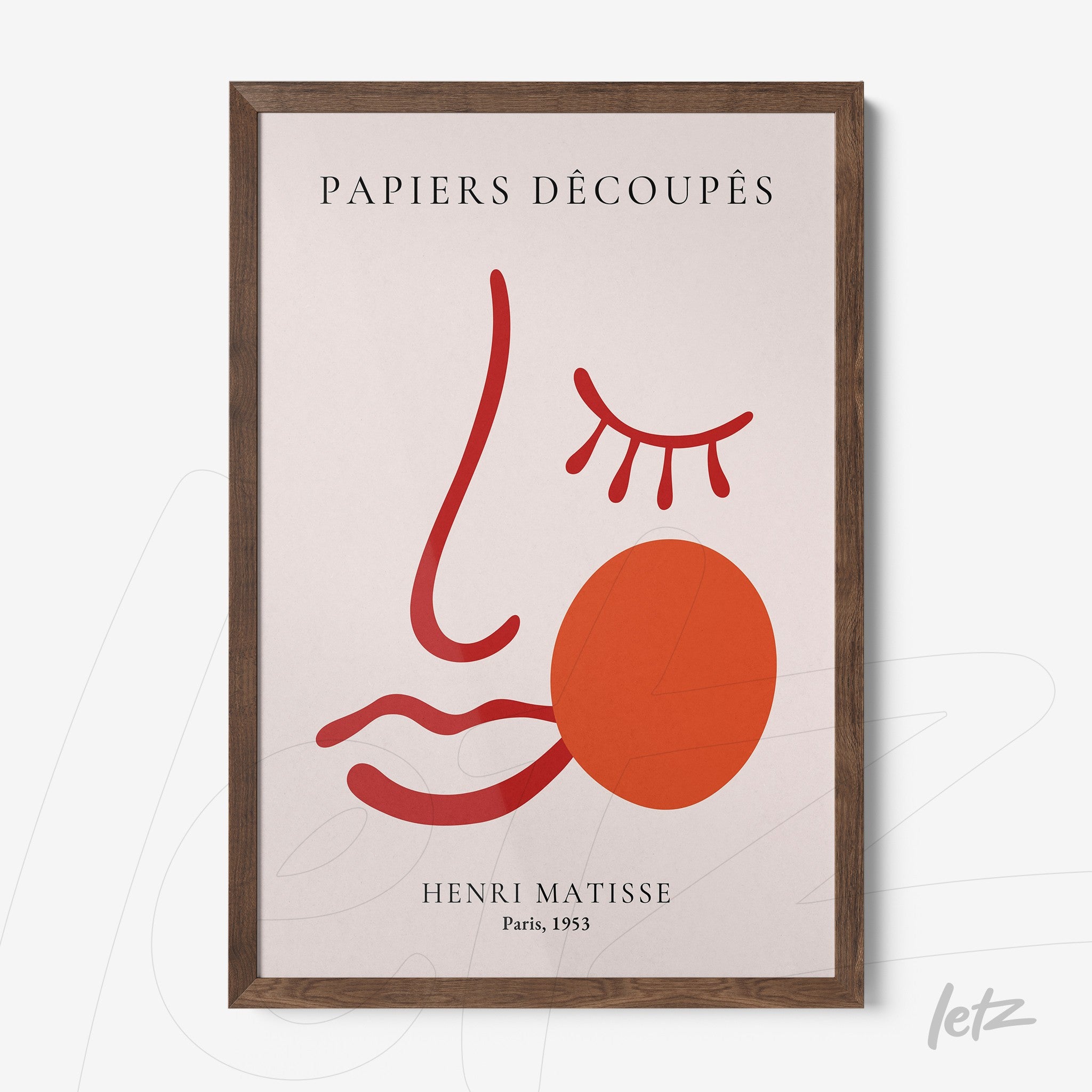 modern art framed print of a stylized face in red tones with a light background and dark wood frame