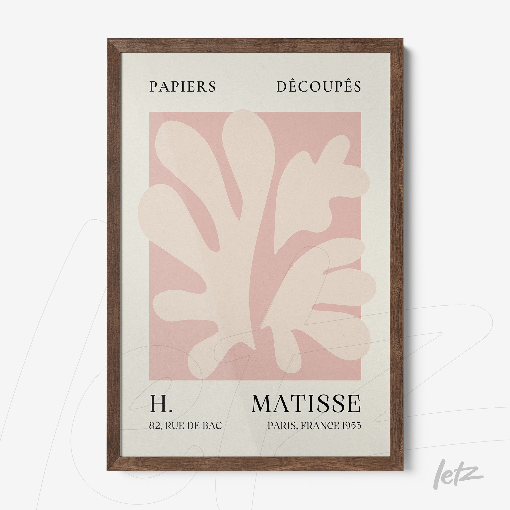 framed wall art featuring modern cut-out design in pastel tones with dark wood frame