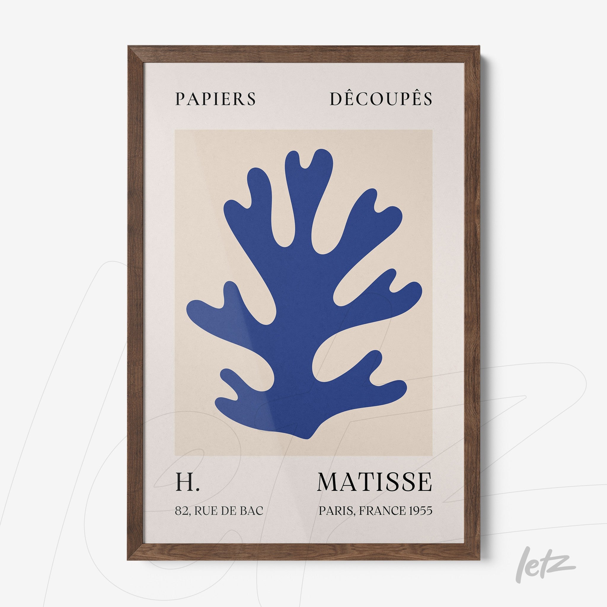 framed modern art print in blue featuring a coral shape with dark wooden frame