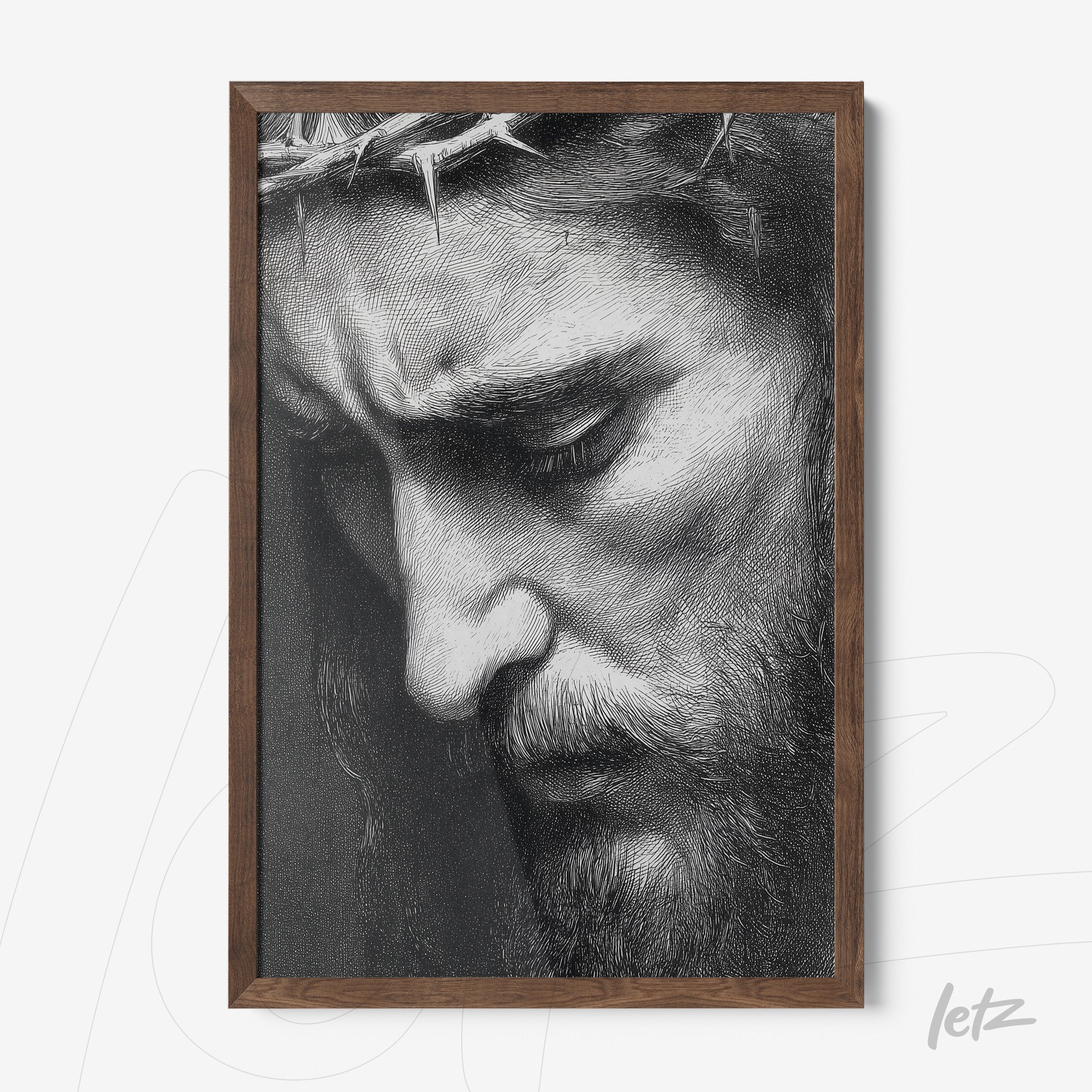 framed black and white portrait of Christ with a contemplative expression and dark wood frame
