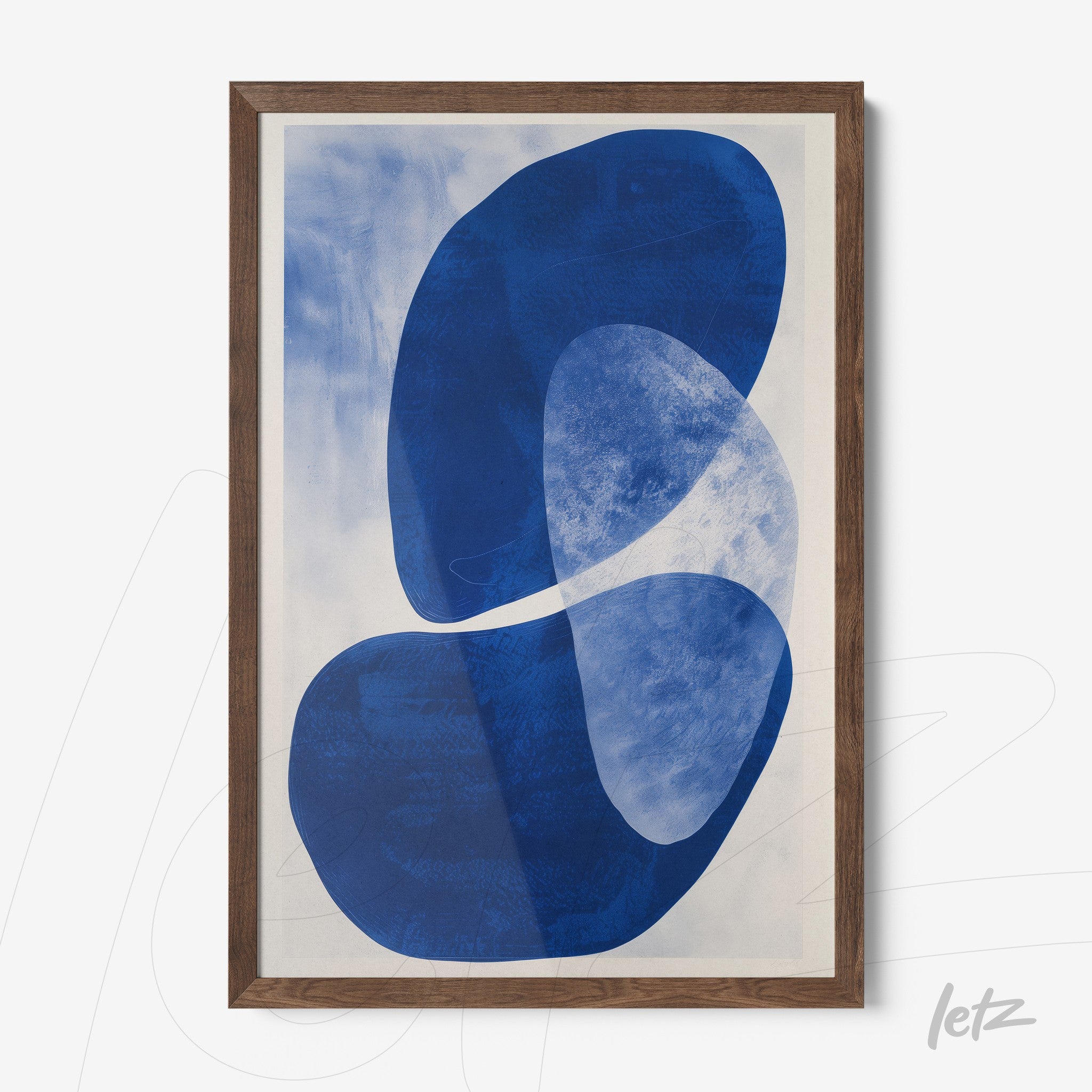abstract wall art in shades of blue displayed in dark wood frame