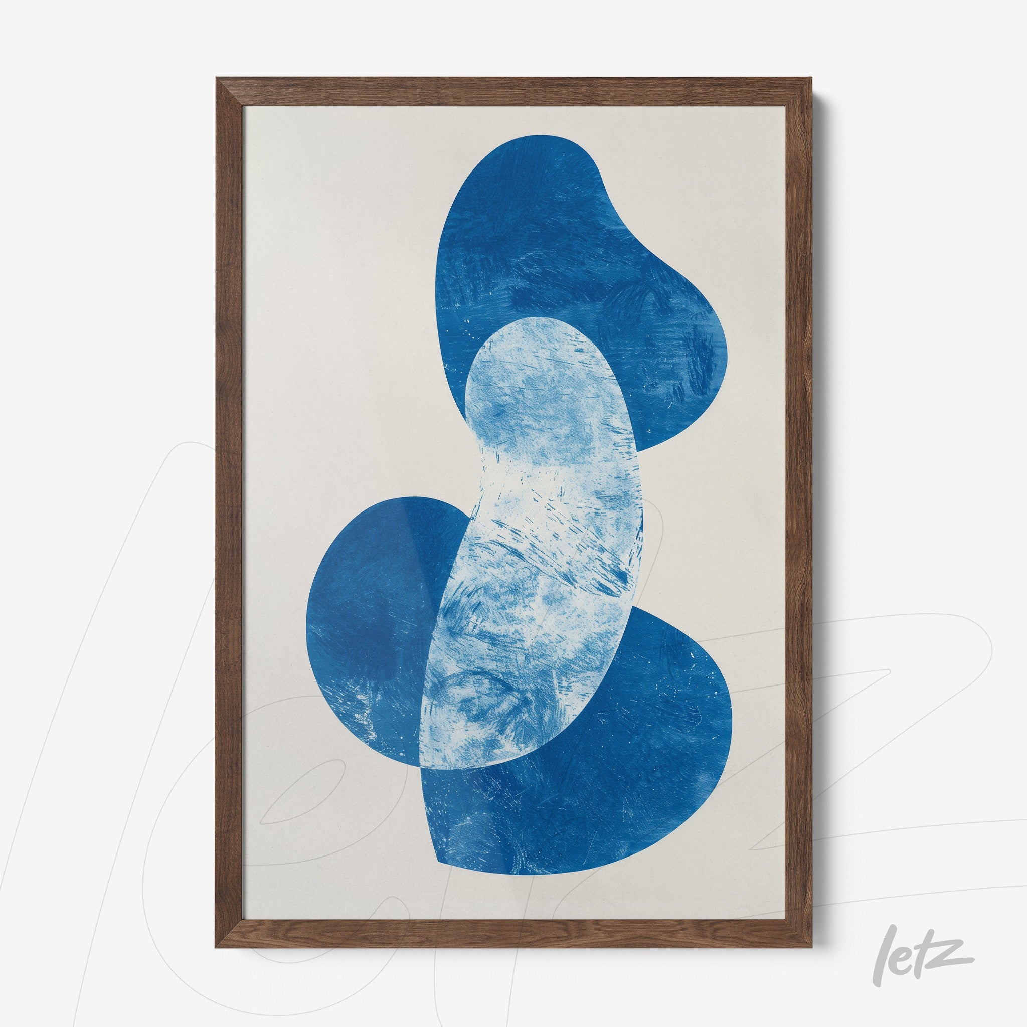 framed wall art featuring abstract shapes in shades of blue with dark wood frame