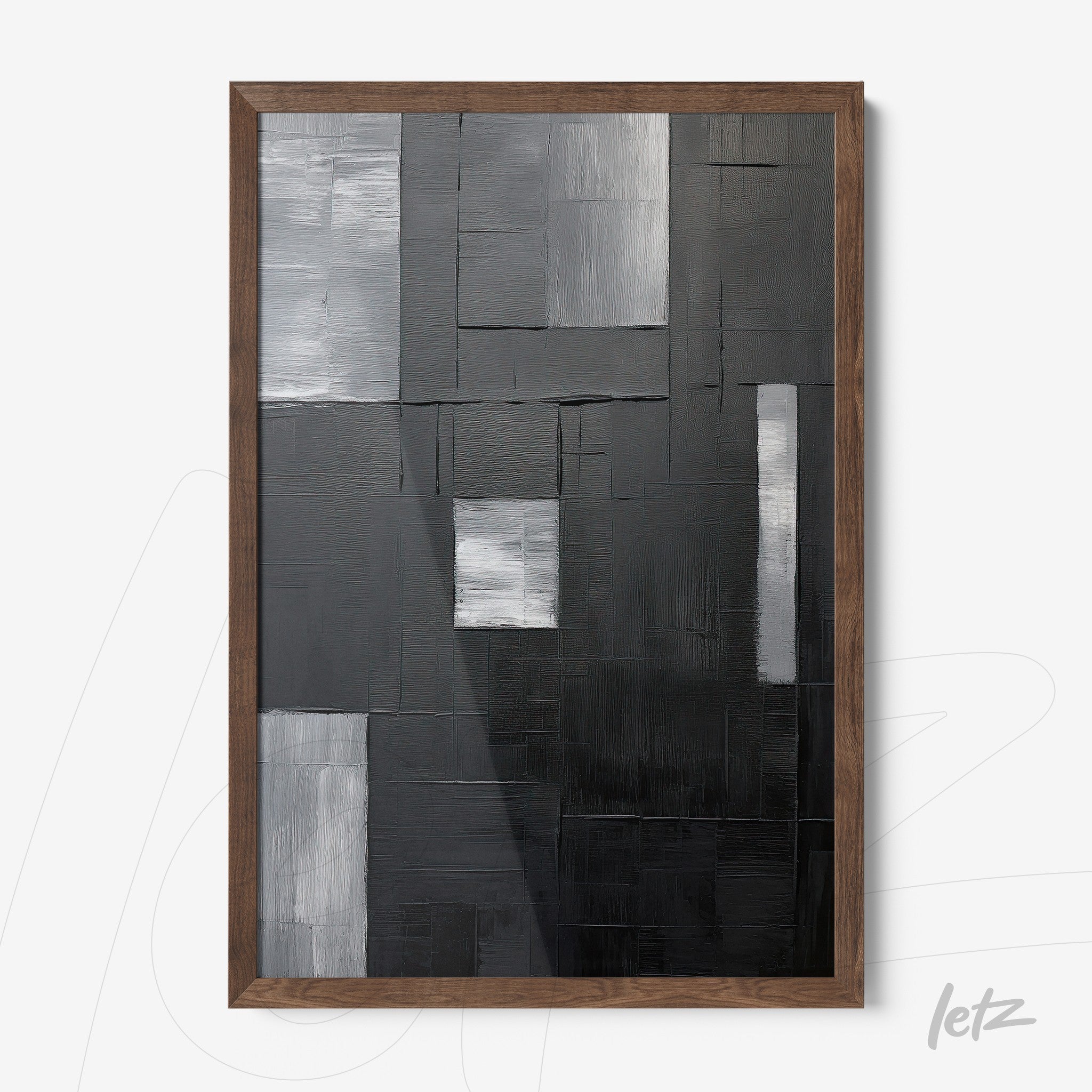 modern abstract wall art in black, gray, and white with geometric texture in dark wooden frame