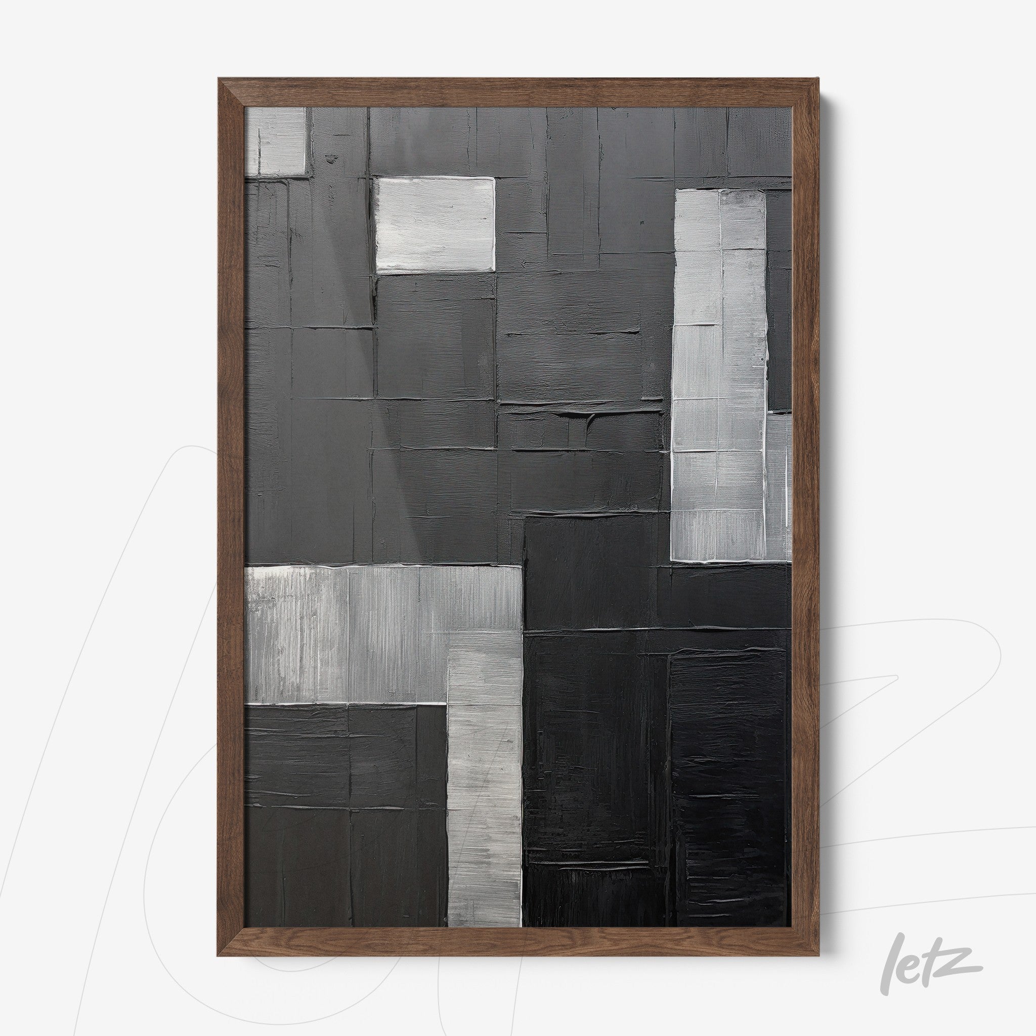 abstract wall art in shades of gray featuring textures on a geometric background, framed in dark wood