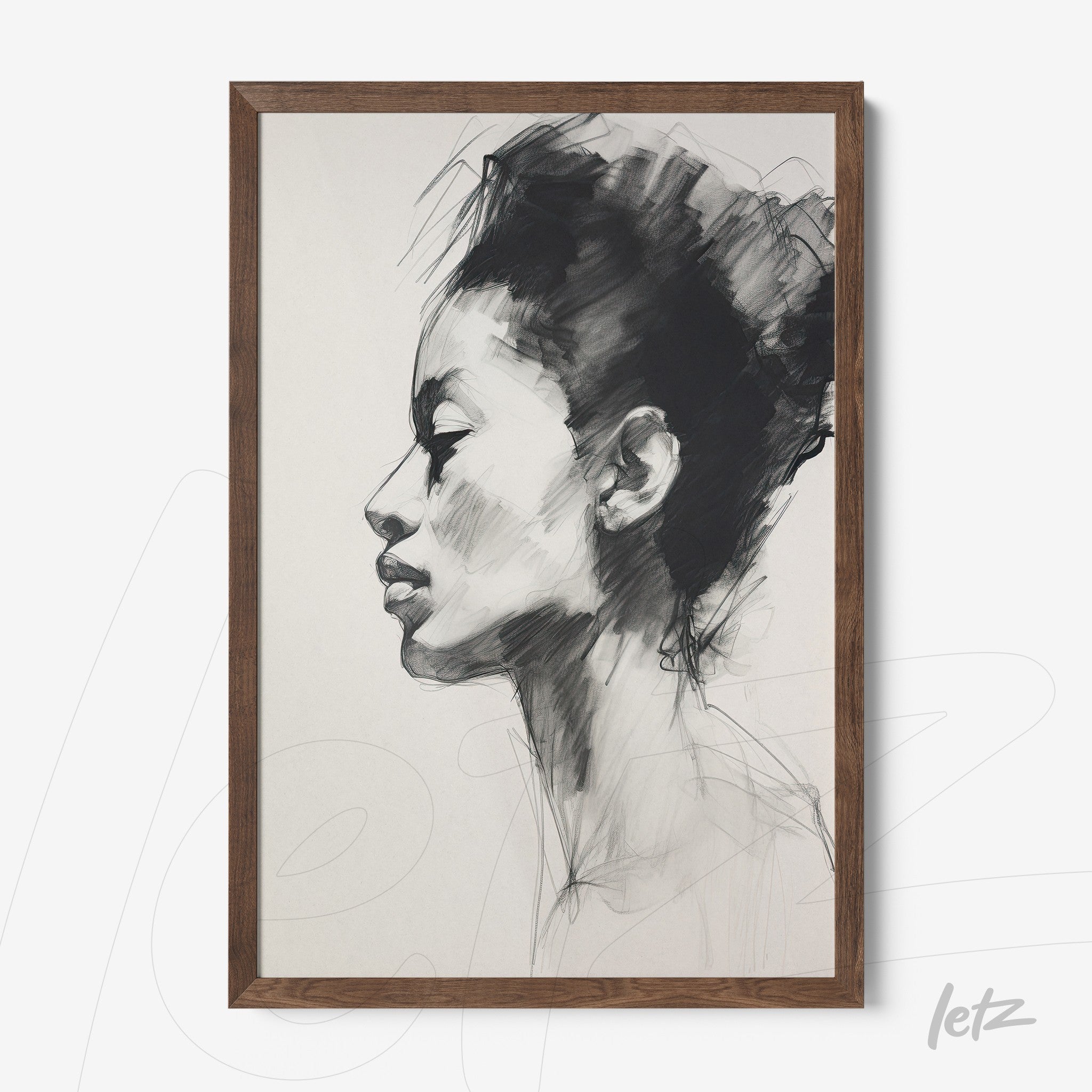 framed wall art featuring a black and white illustration of a woman's profile in a dark wood frame