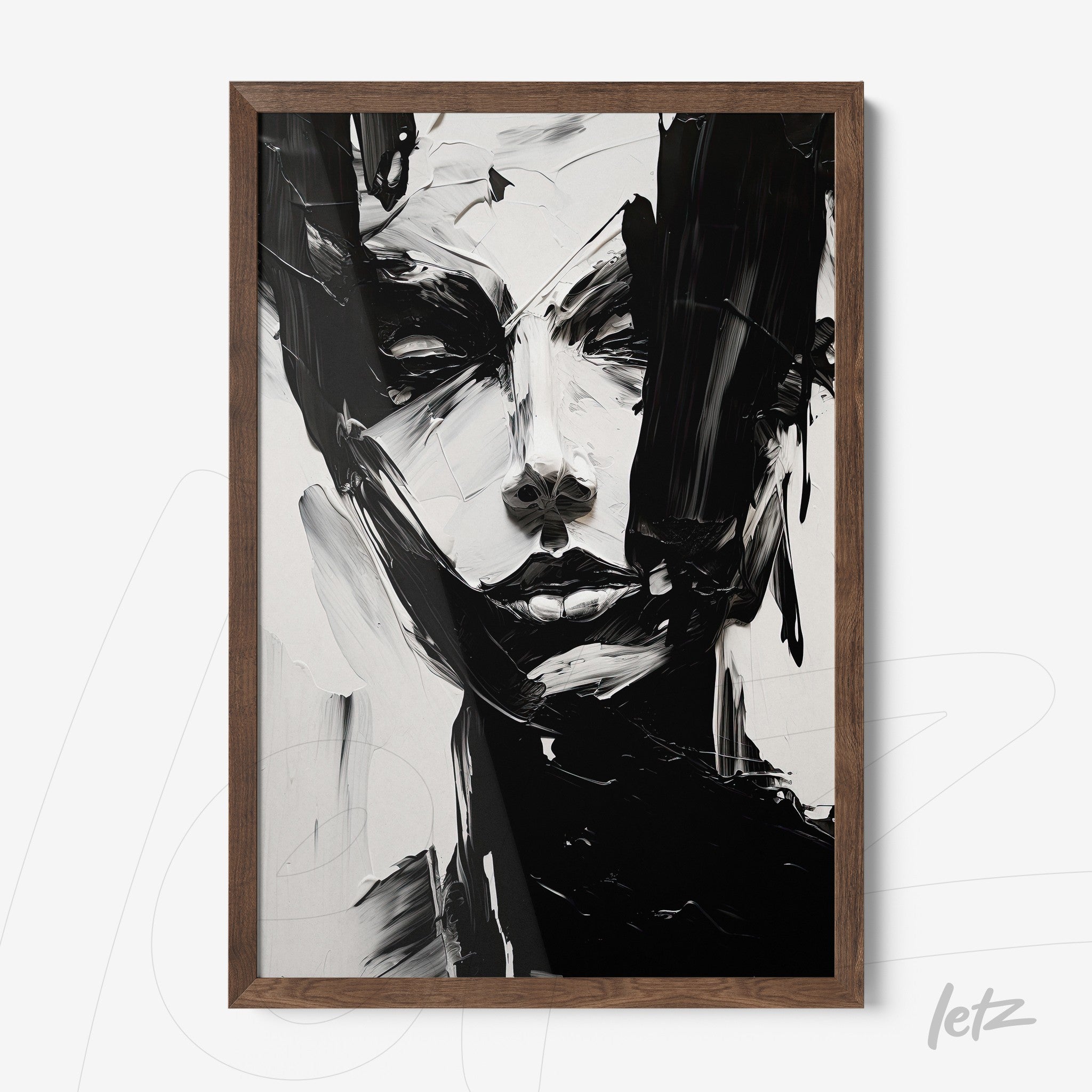 modern wall art in black and white depicting a female face in dark wooden frame