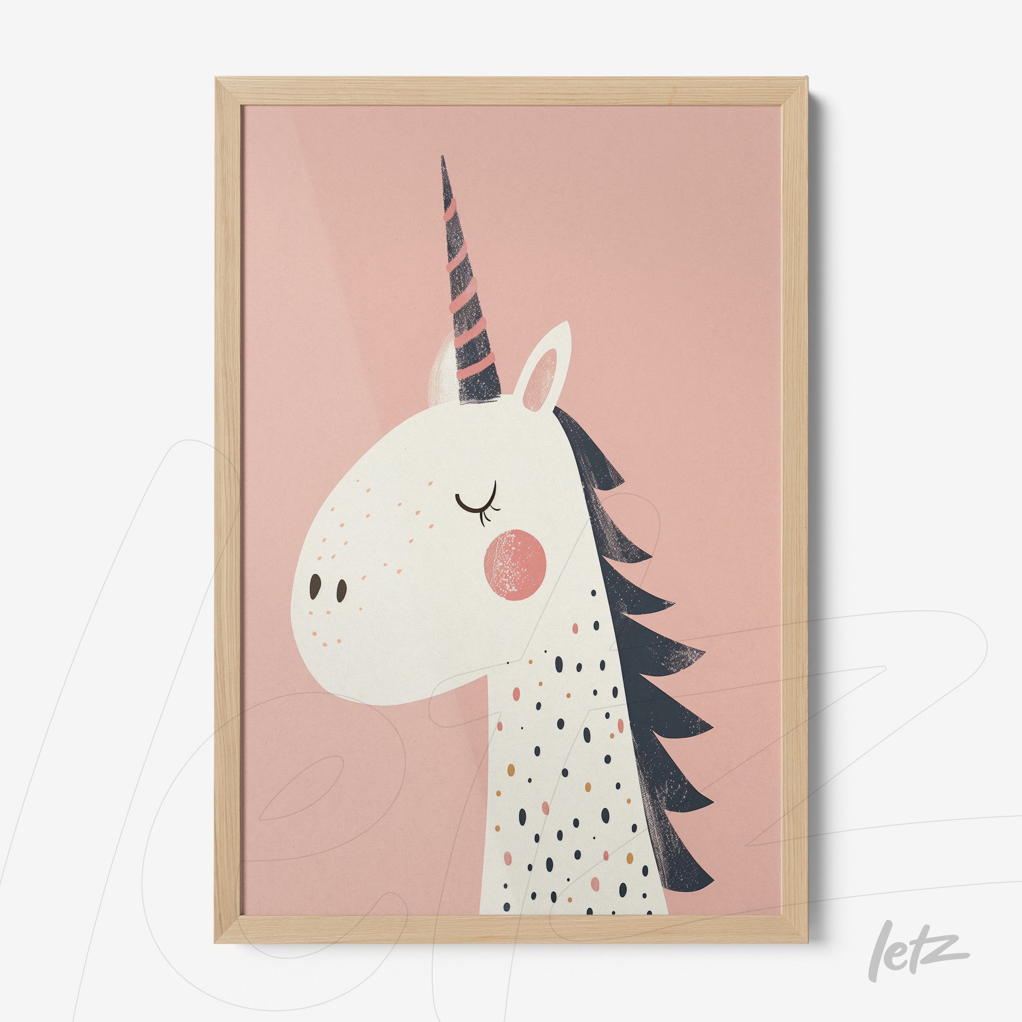 framed artwork featuring a unicorn illustration on pink background with light wood frame