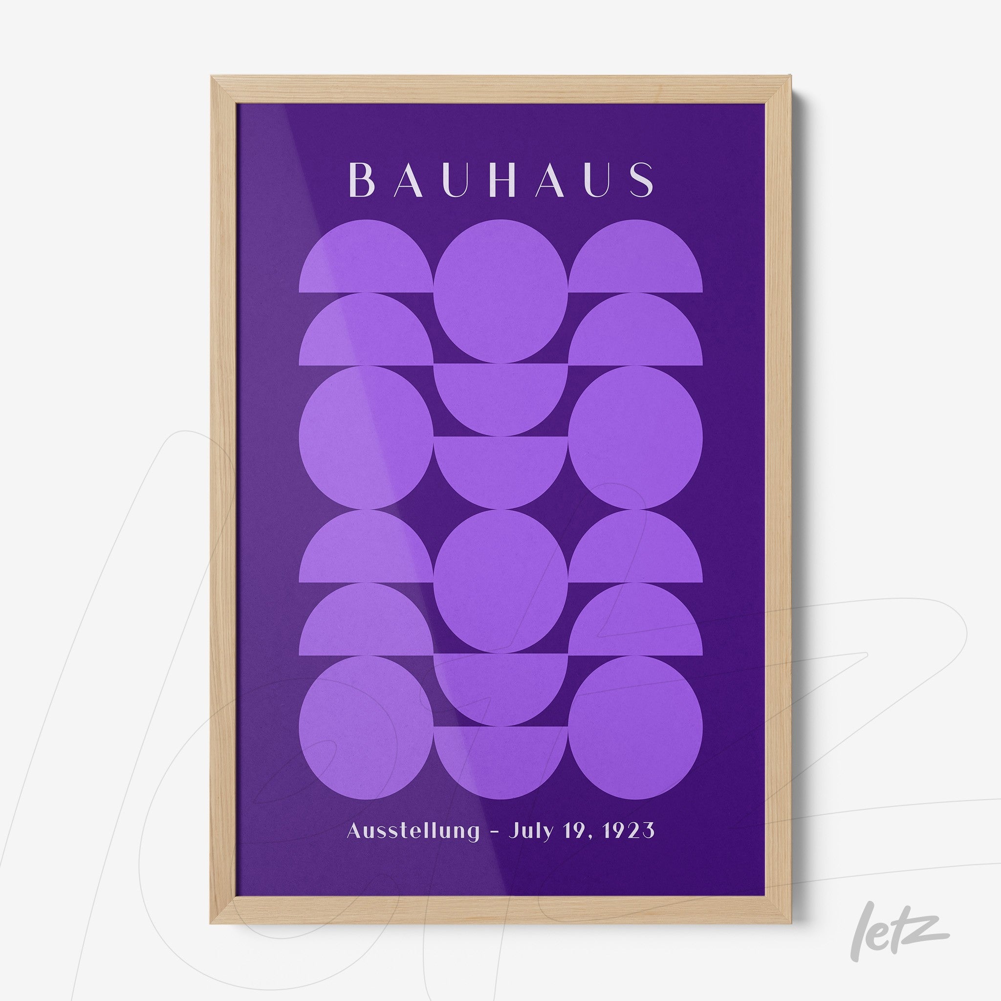bauhaus style geometric purple shapes in light wood frame