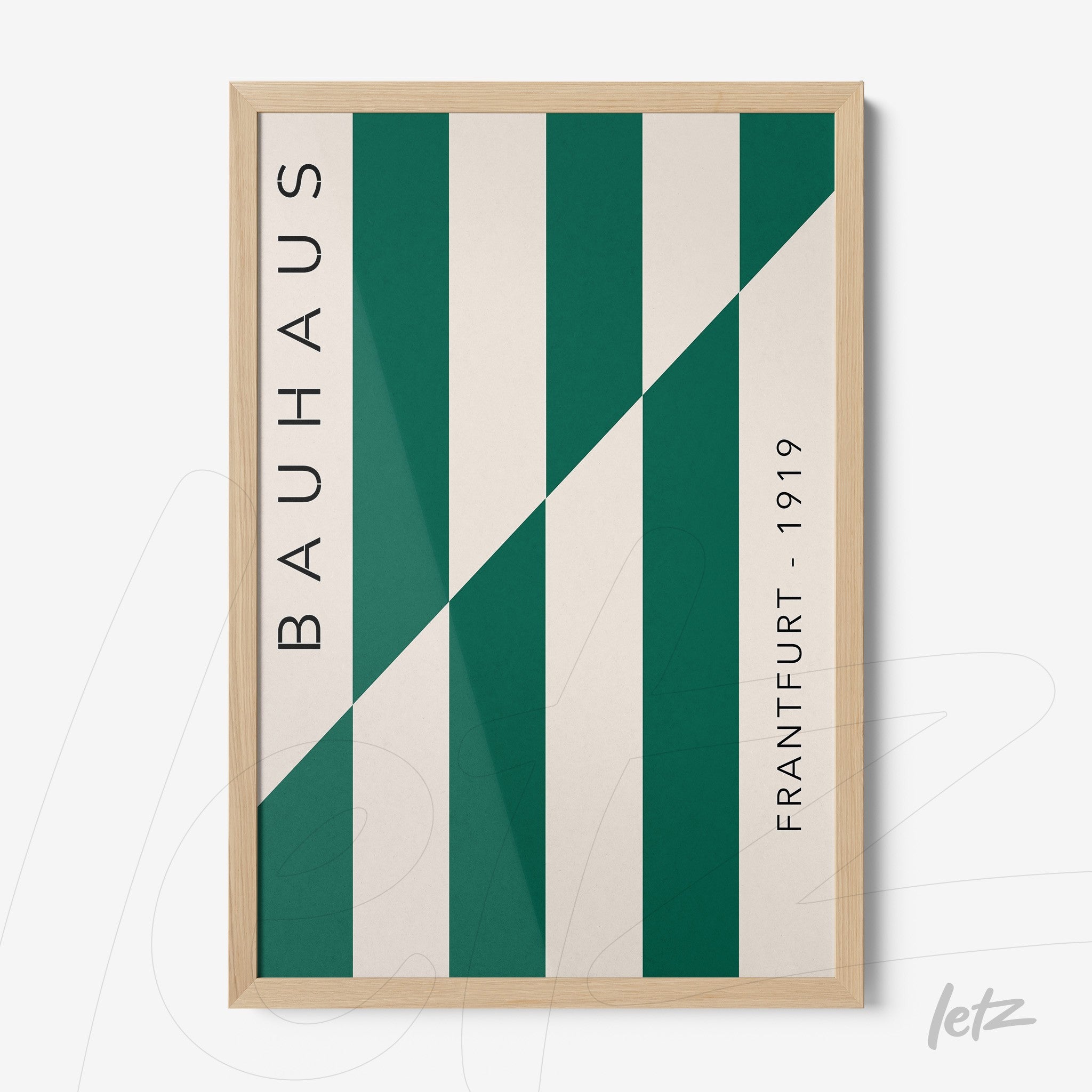 bauhaus style art with green diagonal stripes in light wood frame