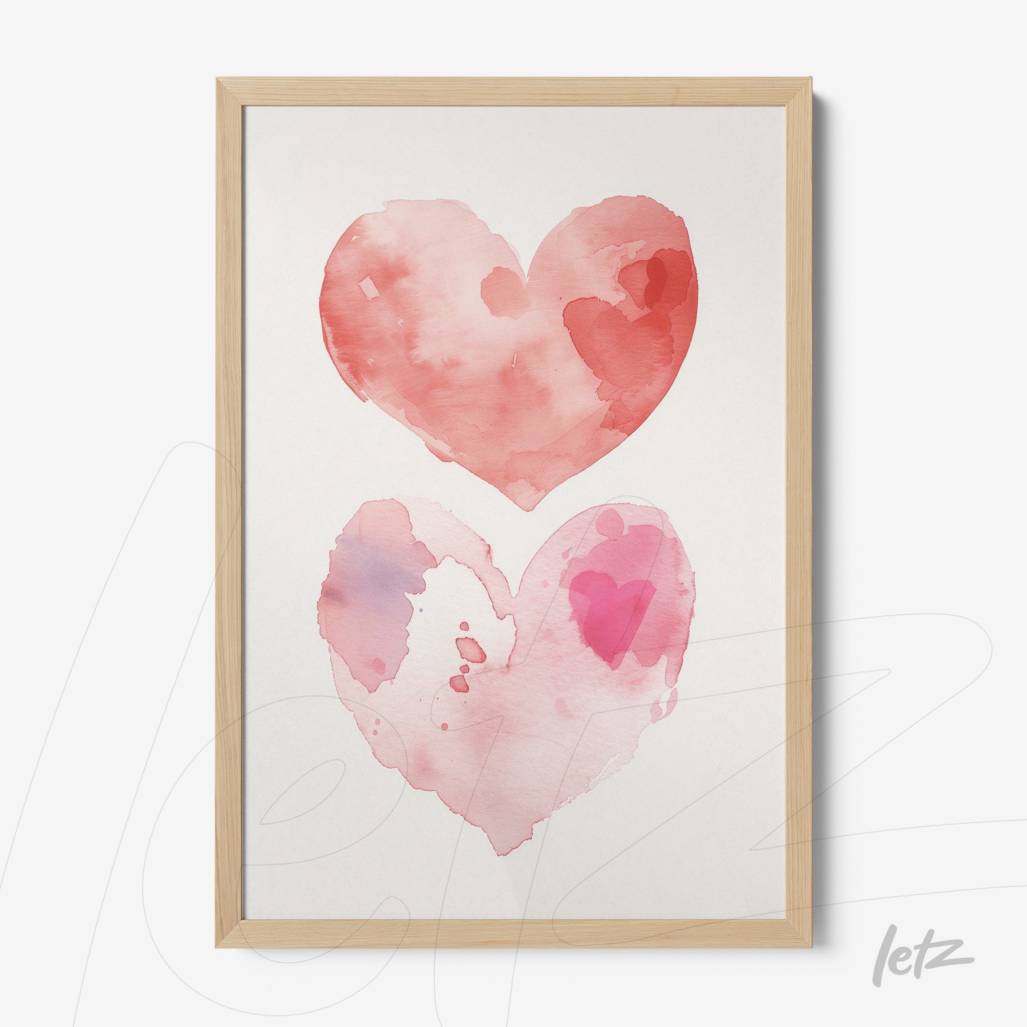 framed watercolor art of two pink hearts with soft hues on light background, set in light wooden frame