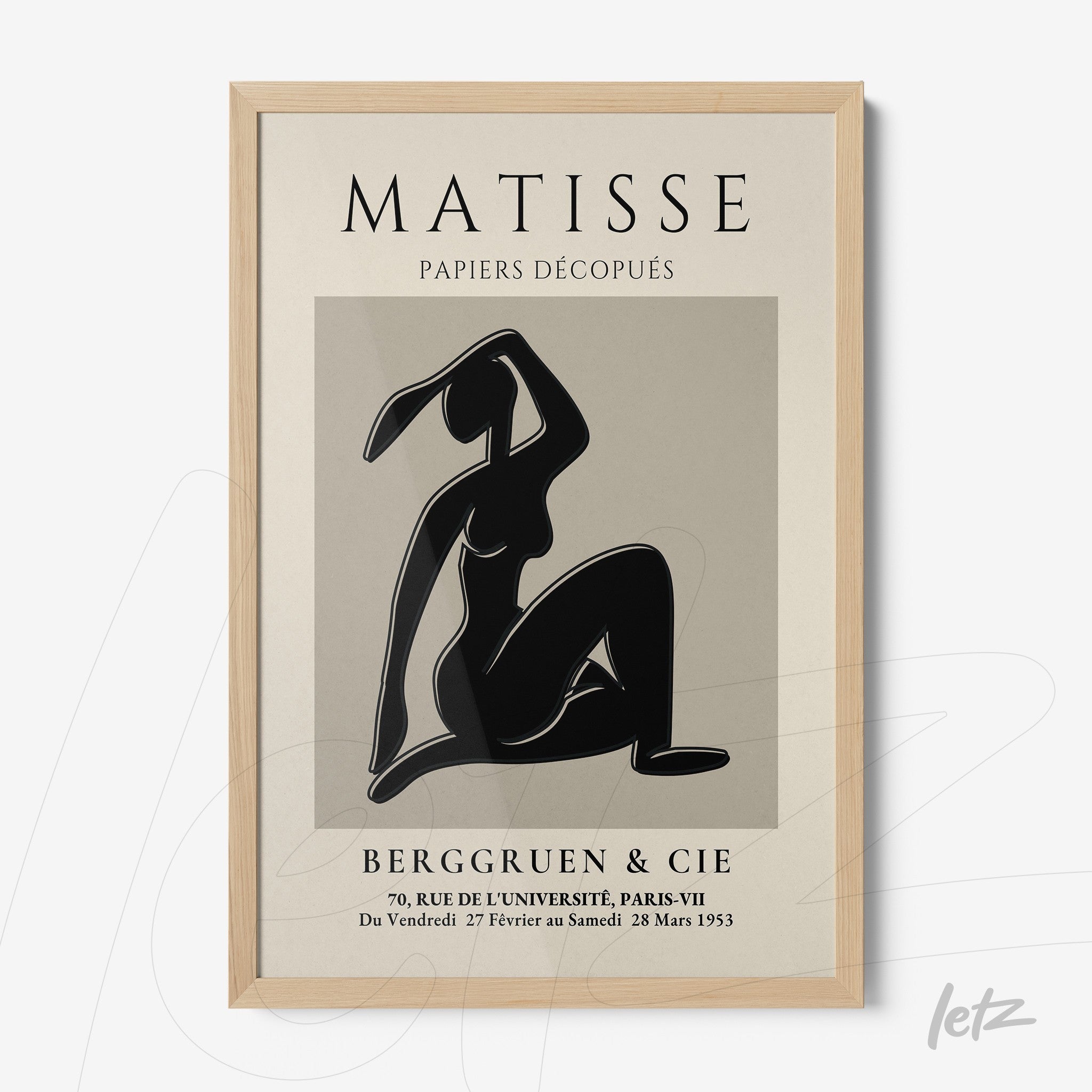 framed modern wall art featuring a black silhouette of a female figure against a gray background with light wood frame
