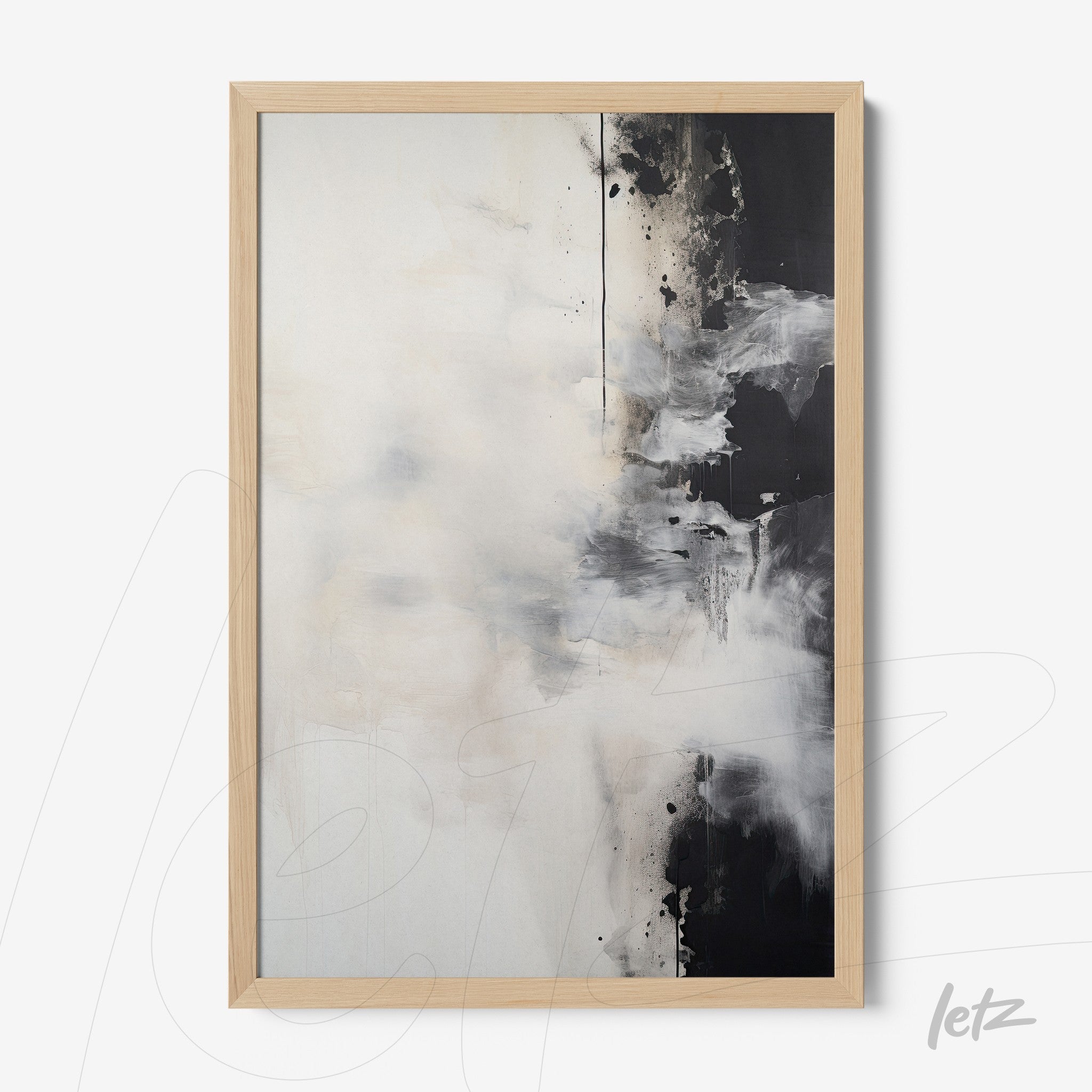 abstract wall art in black and white framed in light wood