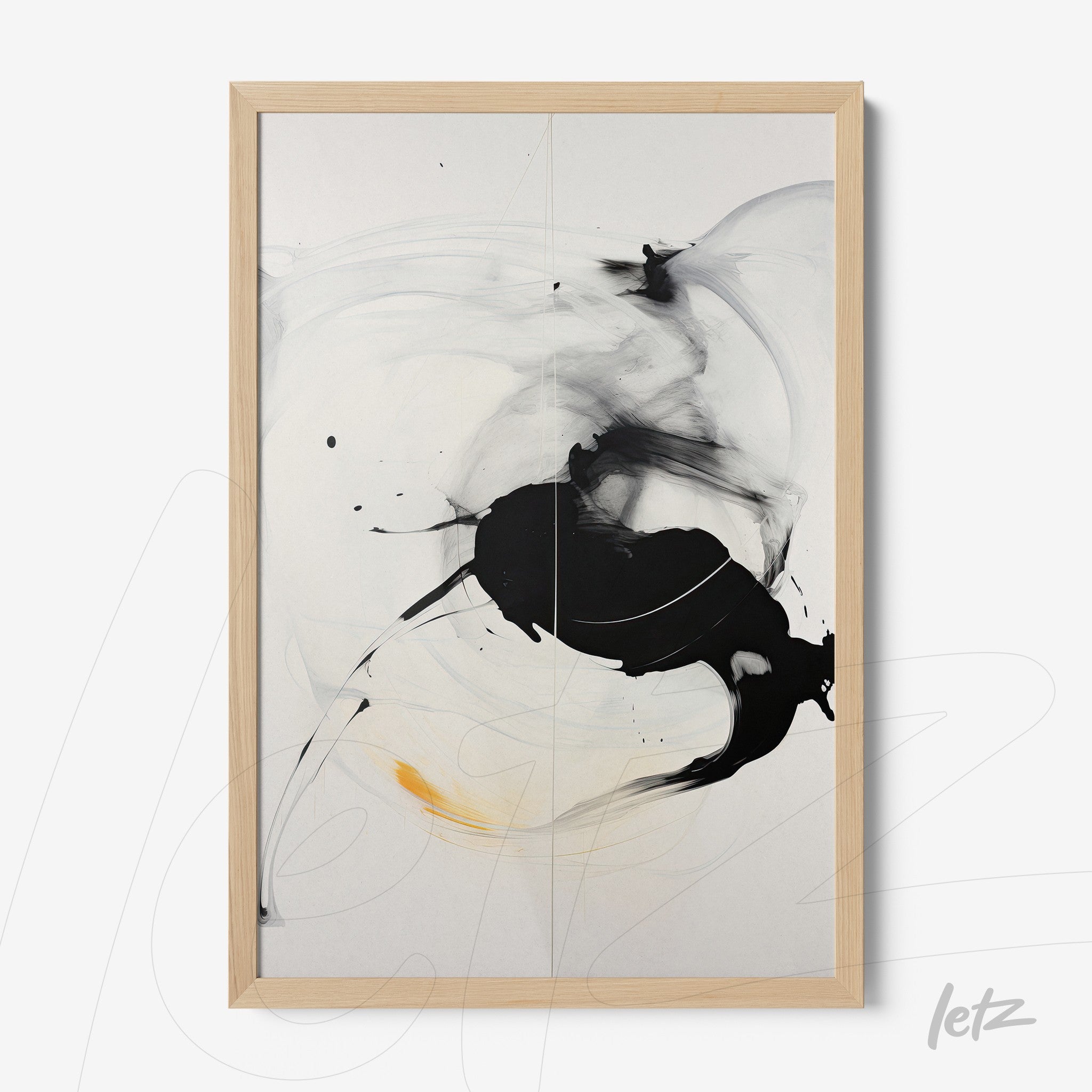 abstract artwork in black and white with hints of orange in a light wooden frame