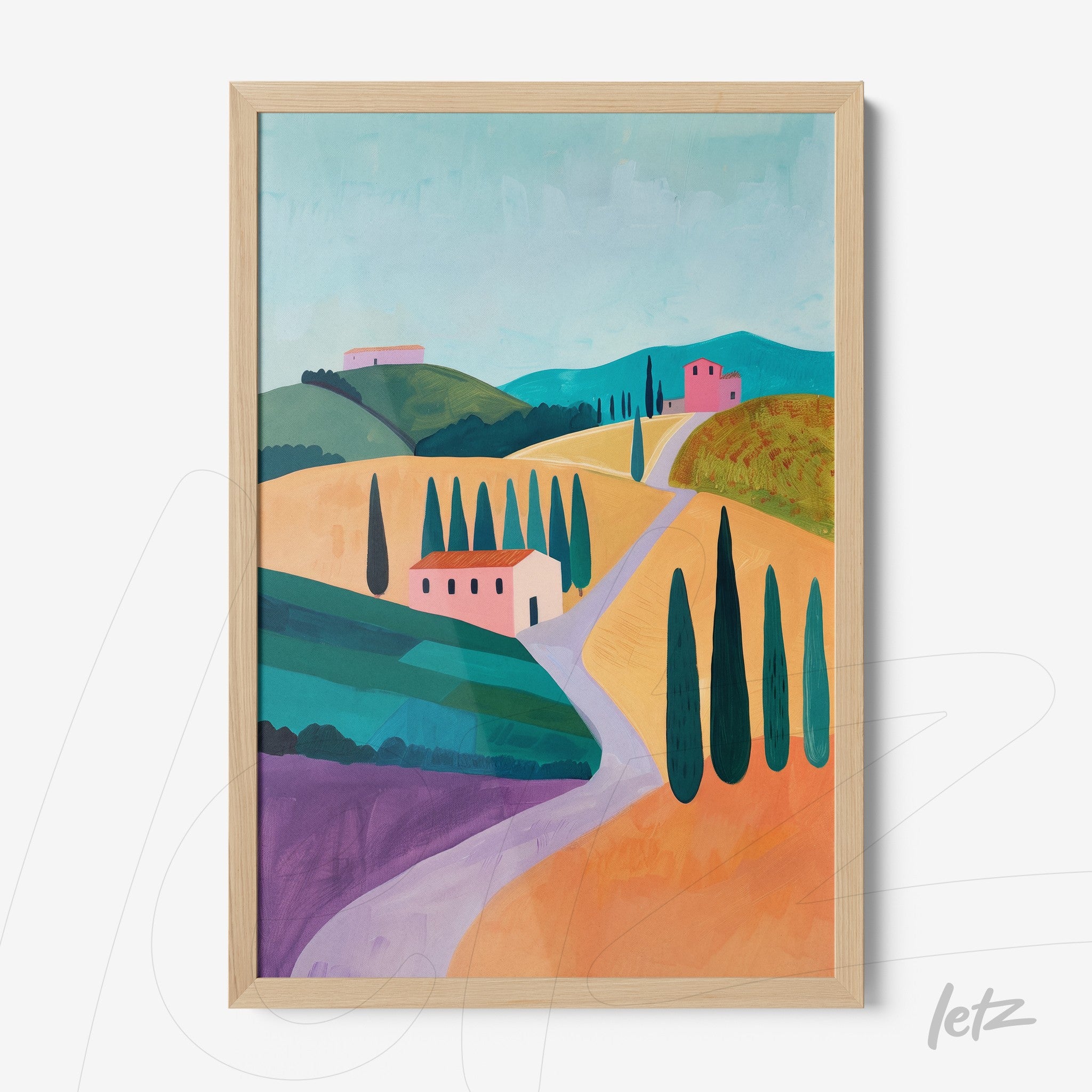 framed artwork featuring a colorful landscape of Italian hills with pink houses and cypress trees
