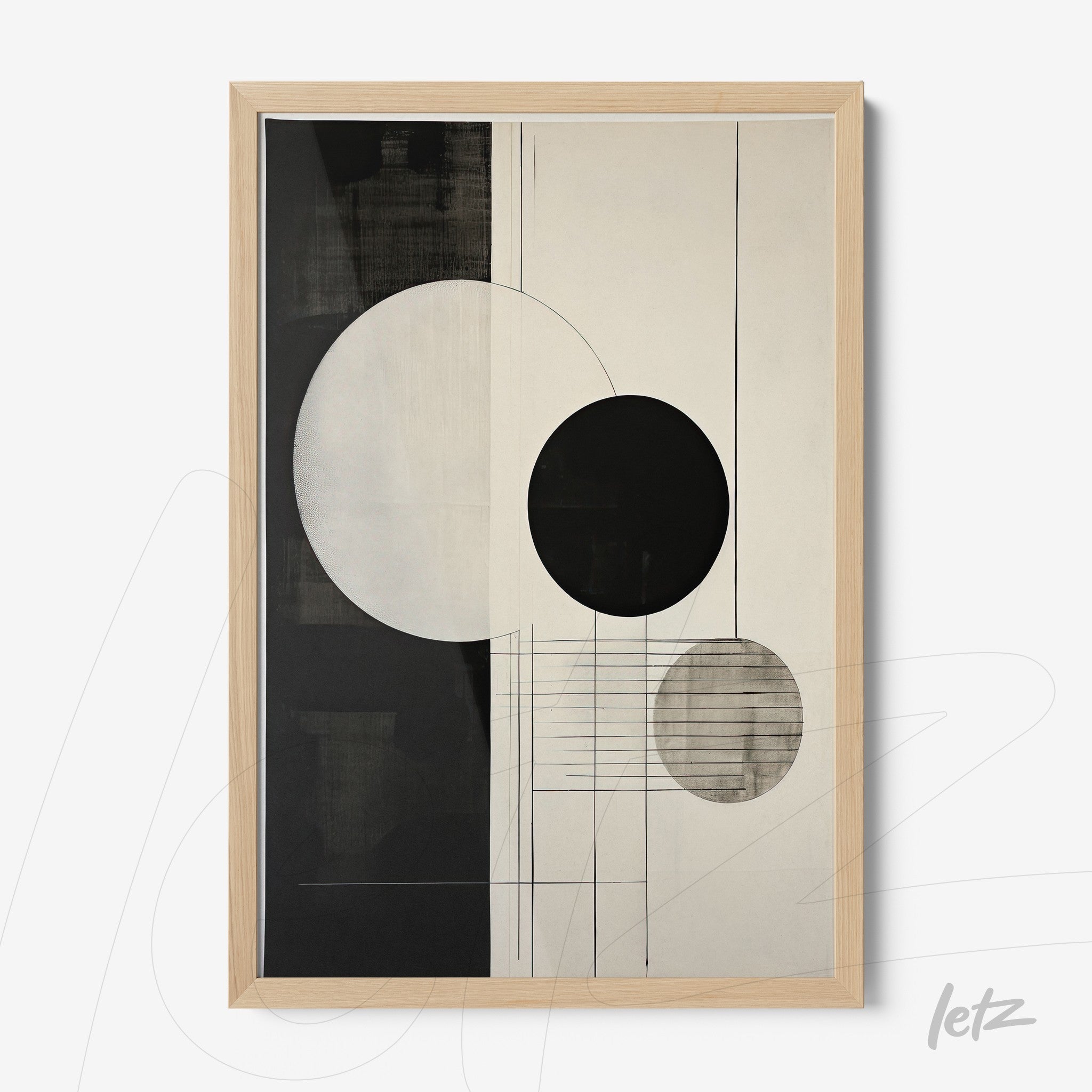 abstract wall art in black and cream tones featuring circles on a smooth background with light wood frame