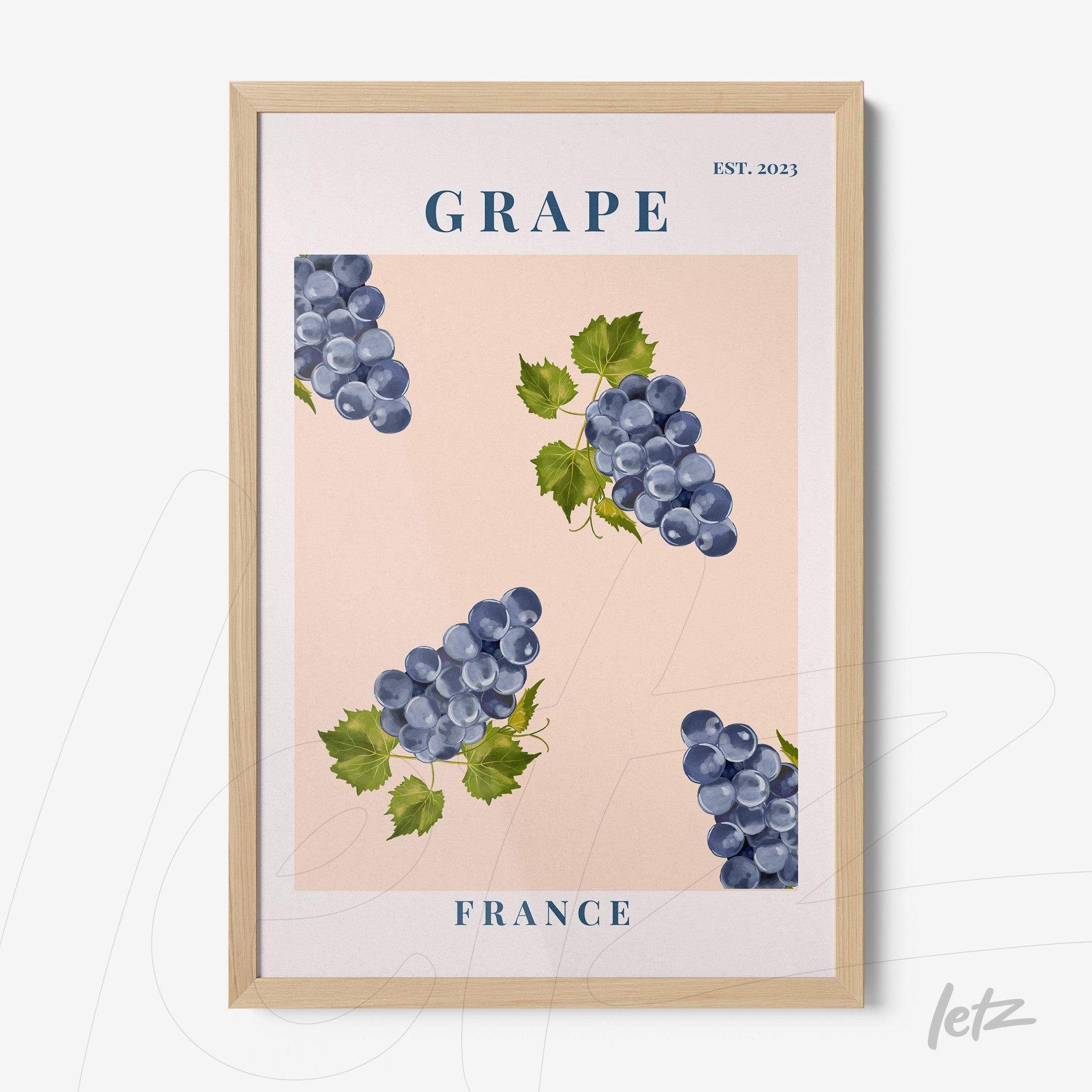 framed wall art featuring illustrations of grapes on a light pink background with a light wood frame