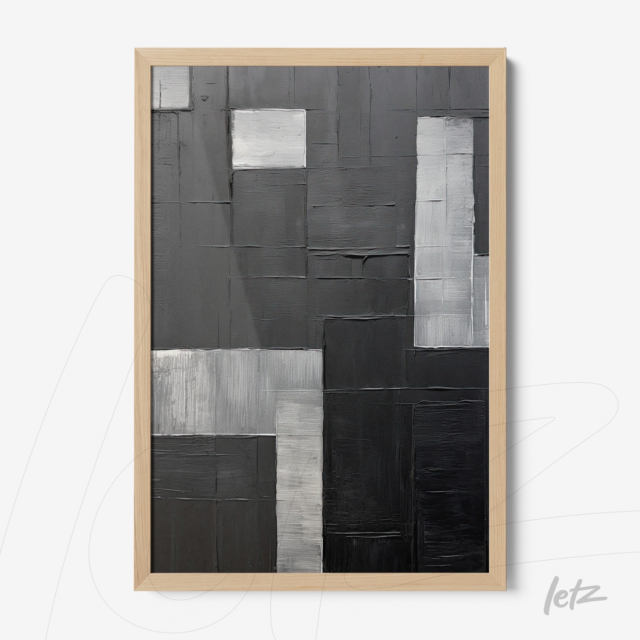 modern artwork in shades of black and gray with thick paint textures in light wood frame
