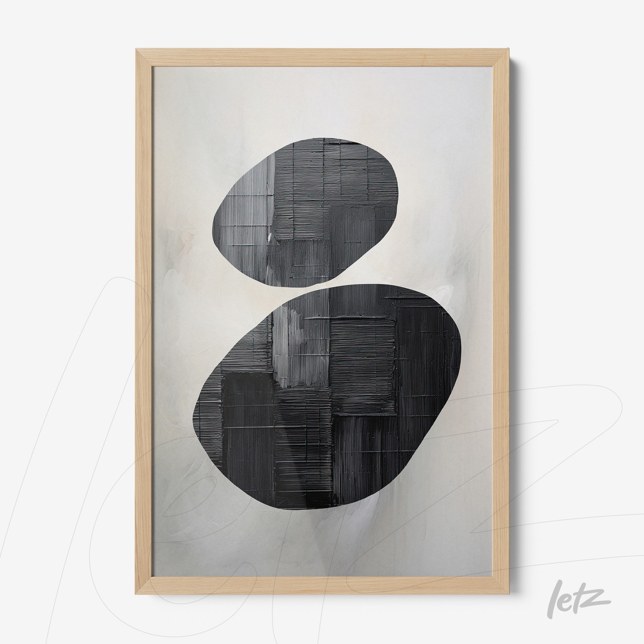 abstract art print in black and white framed in light wood