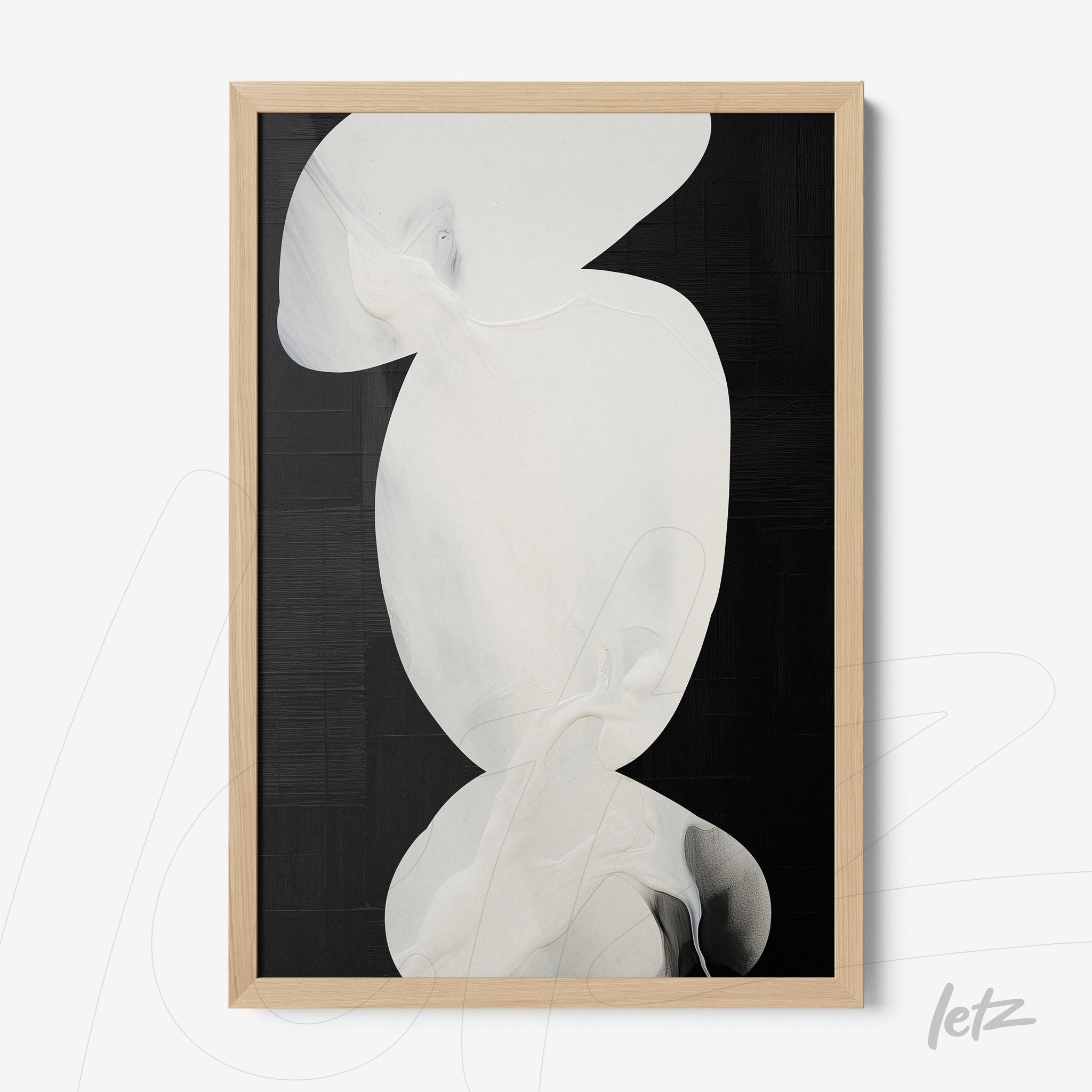 abstract wall art in white tones on a black background with light wood frame