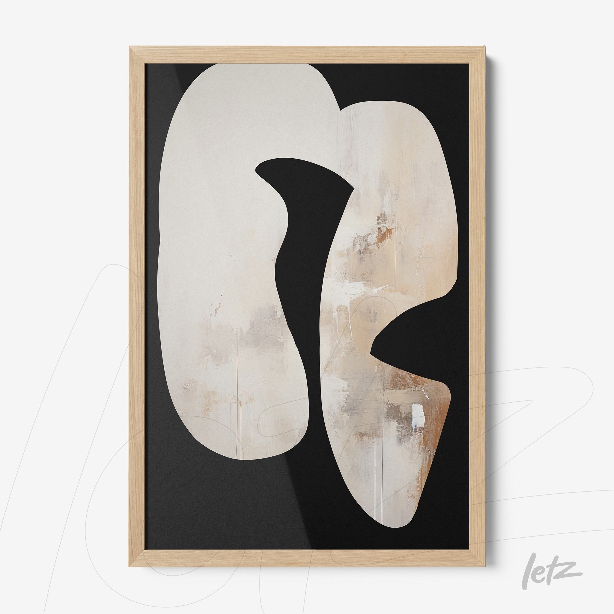 framed abstract wall art with neutral colors featuring an organic shape on black background and light wood frame